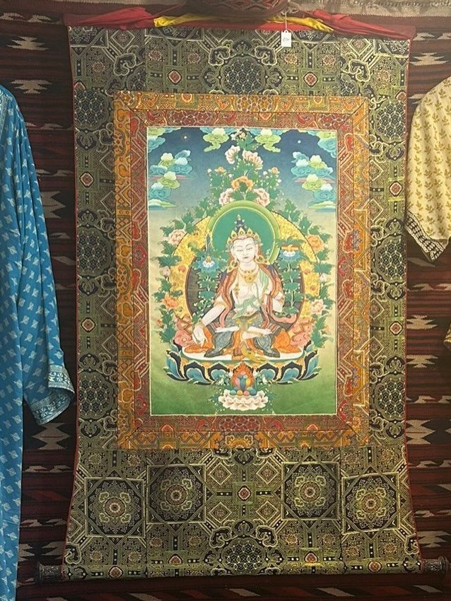 This exceptionally beautiful White Tara thangka has just arrived in Nomads - hand painted onto canvas with gorgeous silk brocade frame. 
This is an original piece painted by a modern day Thangka master (Lama). They train for a minimum of 15 years und