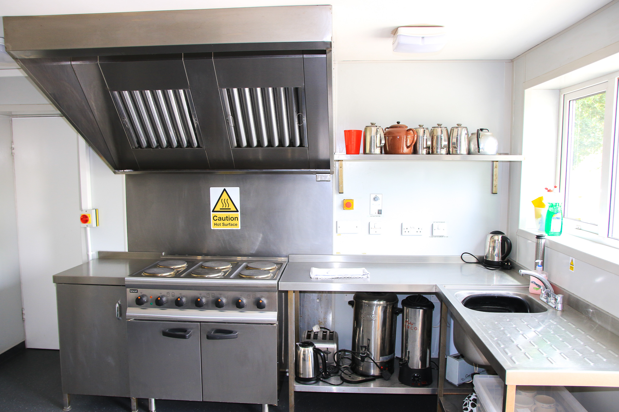 Commercial grade kitchen with electric oven, extractor hood, kettles, hot water urns and toaster