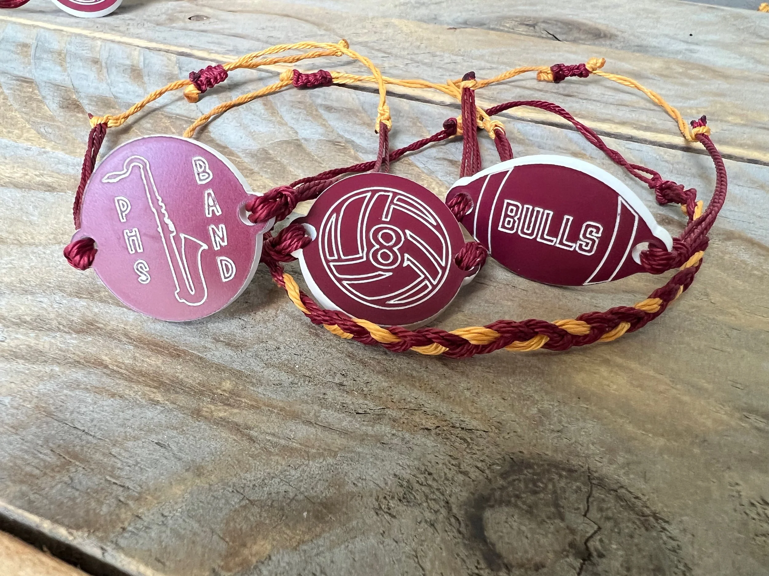 Charm bracelets and zipper pulls