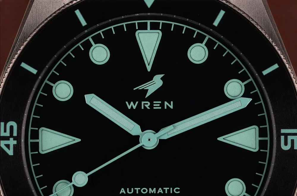 Macro of the Diver One Abyss dial, the aqua markers and hands floating with no visible dial surface behind them