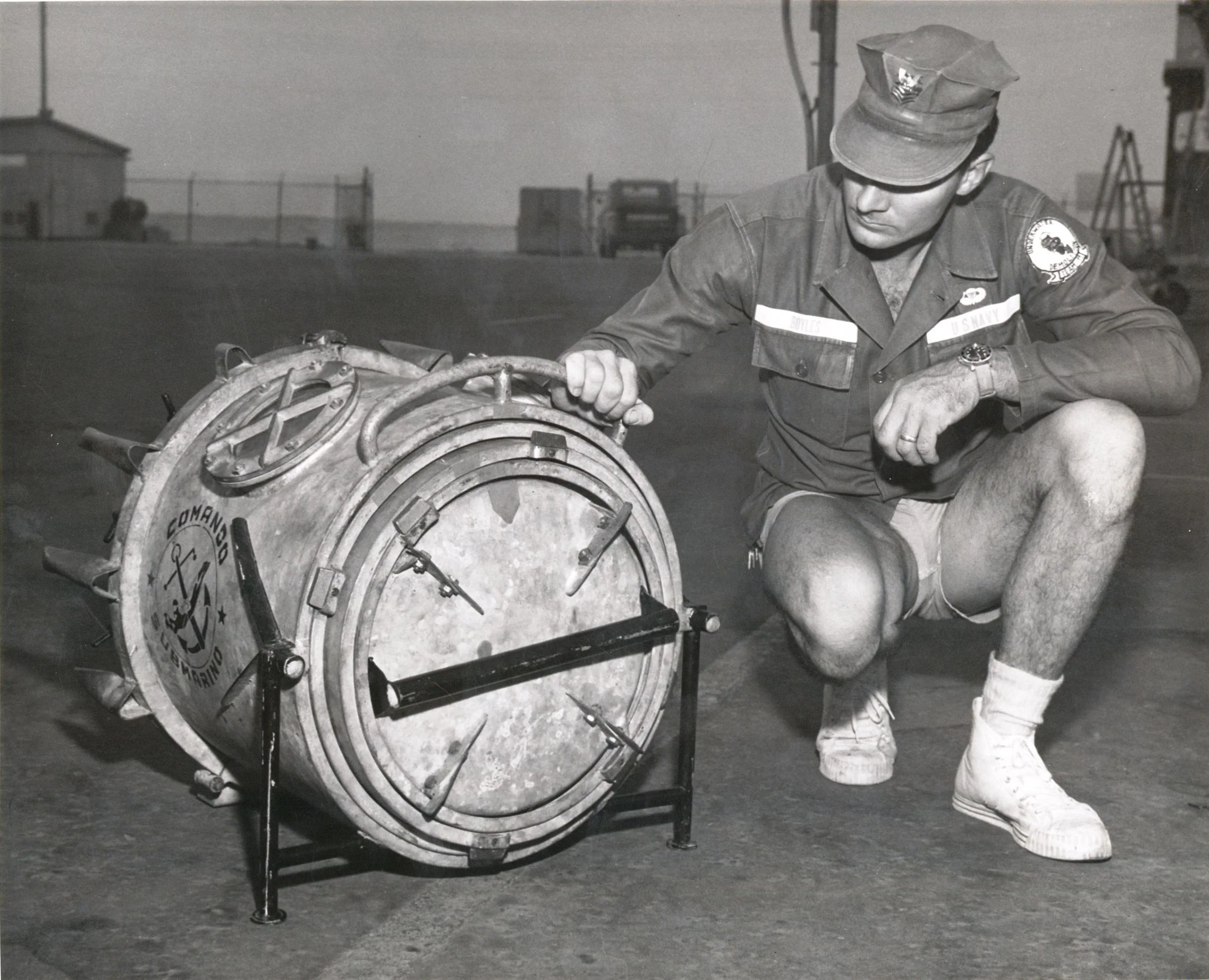 A UDT 11 team member in the 1960s wearing a Tudor Submariner ref. 7928 while working on a portable decompression chamber