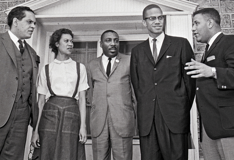  Meeting in Chester, Pennsylvania, hosted by Freedom Now Committee, March 14, 1964, to form Black rights group ACT. From left, Lawrence Landry, Chicago school boycott leader; Gloria Richardson; comedian Dick Gregory; Malcolm X; and Stanley Branche, c