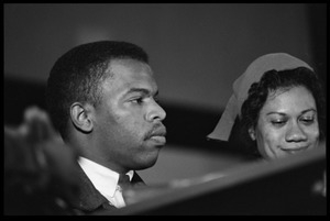  John Lewis (left) and Gloria Richardson seated on a panel at the Youth, Non-Violence, and Social Change conference, Howard University, November 5, 1963 