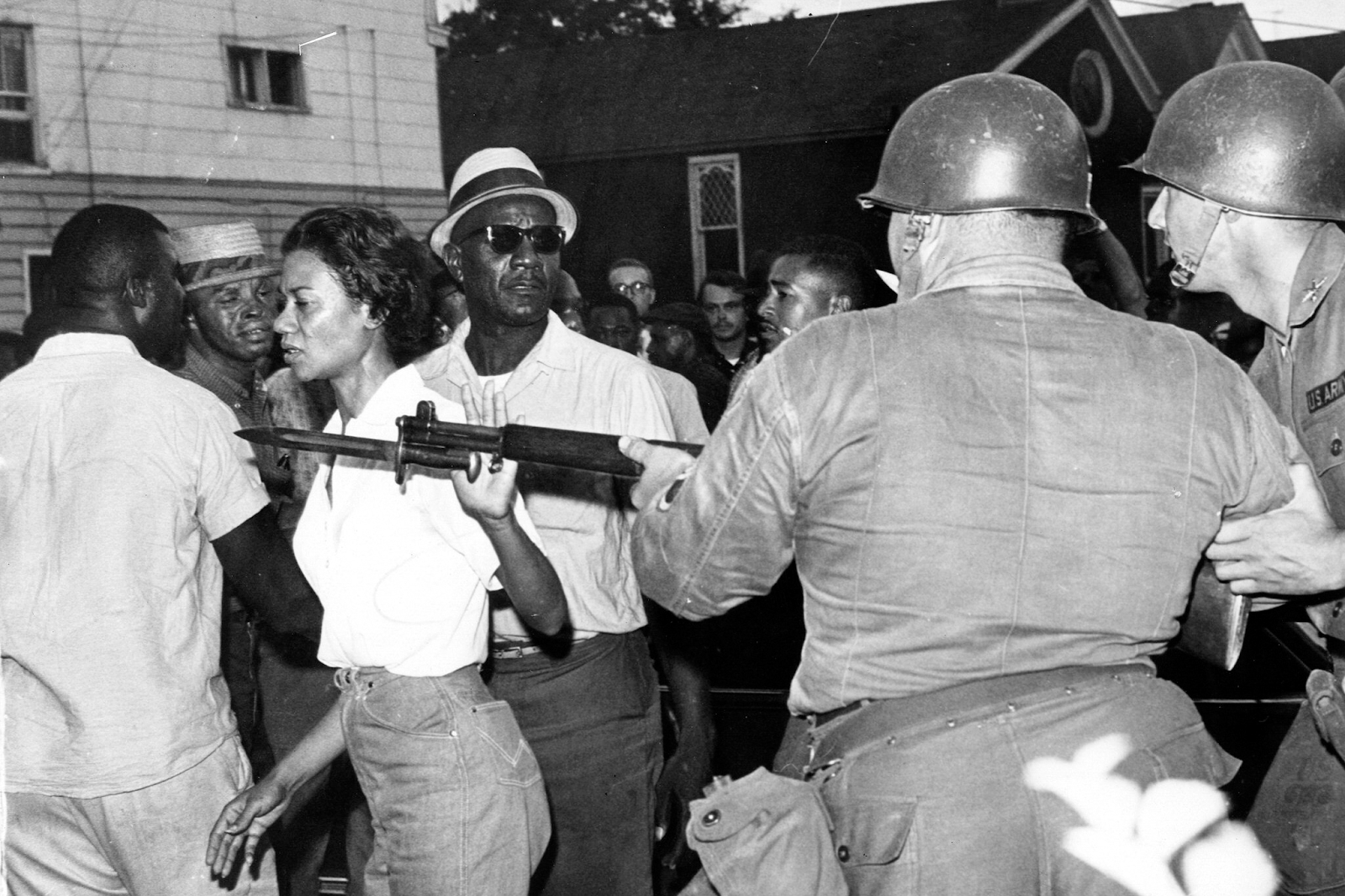  Richardson, head of the Cambridge Nonviolent Action Committee, pushes a National Guardsman’s bayonet aside in Cambridge, Md., on July 21, 1963. (AP) 