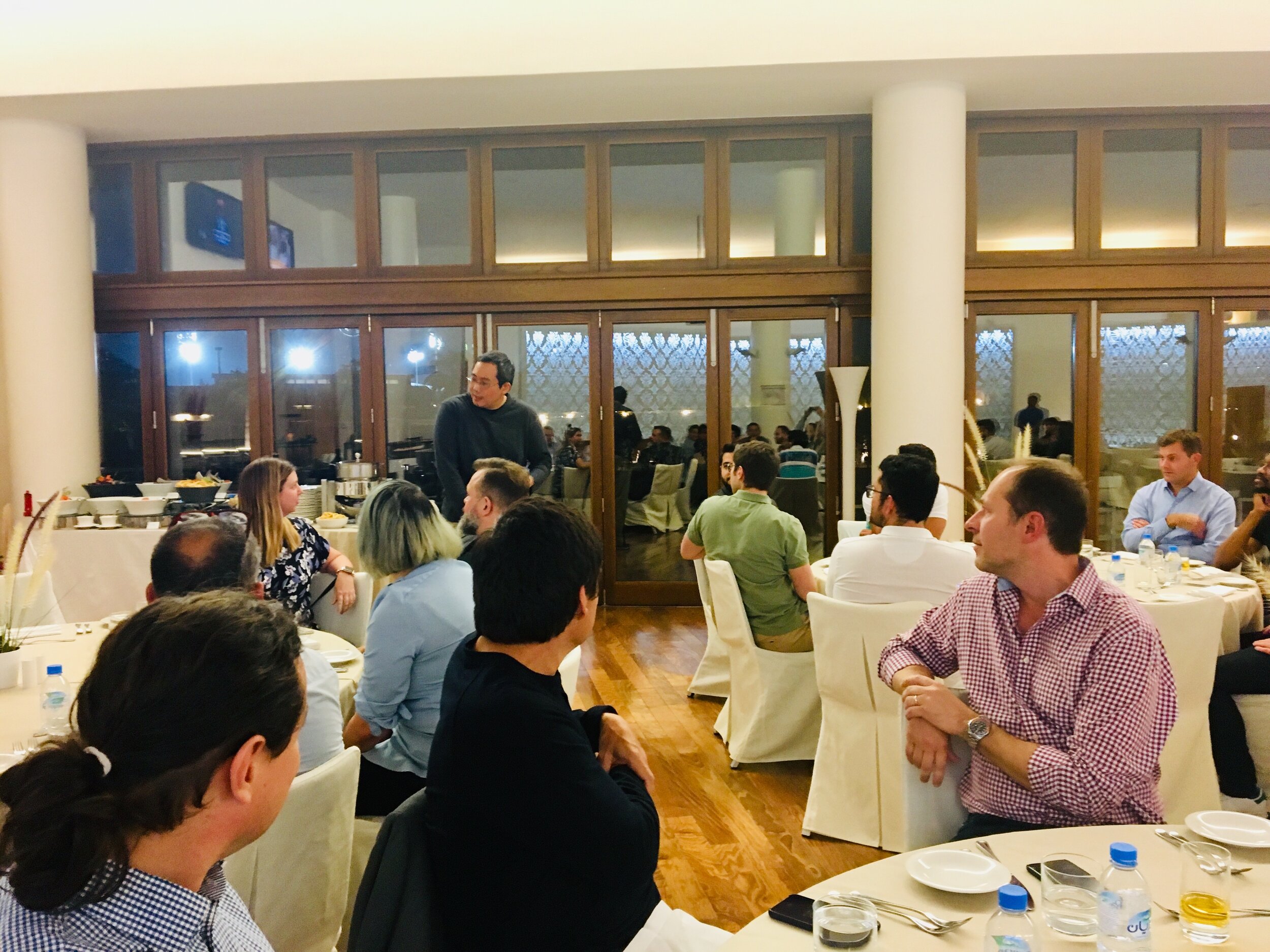 First Night dinner Chris Yeh leads the Hamilton Dinner Experience to encourage equal sharing and team bonding.
