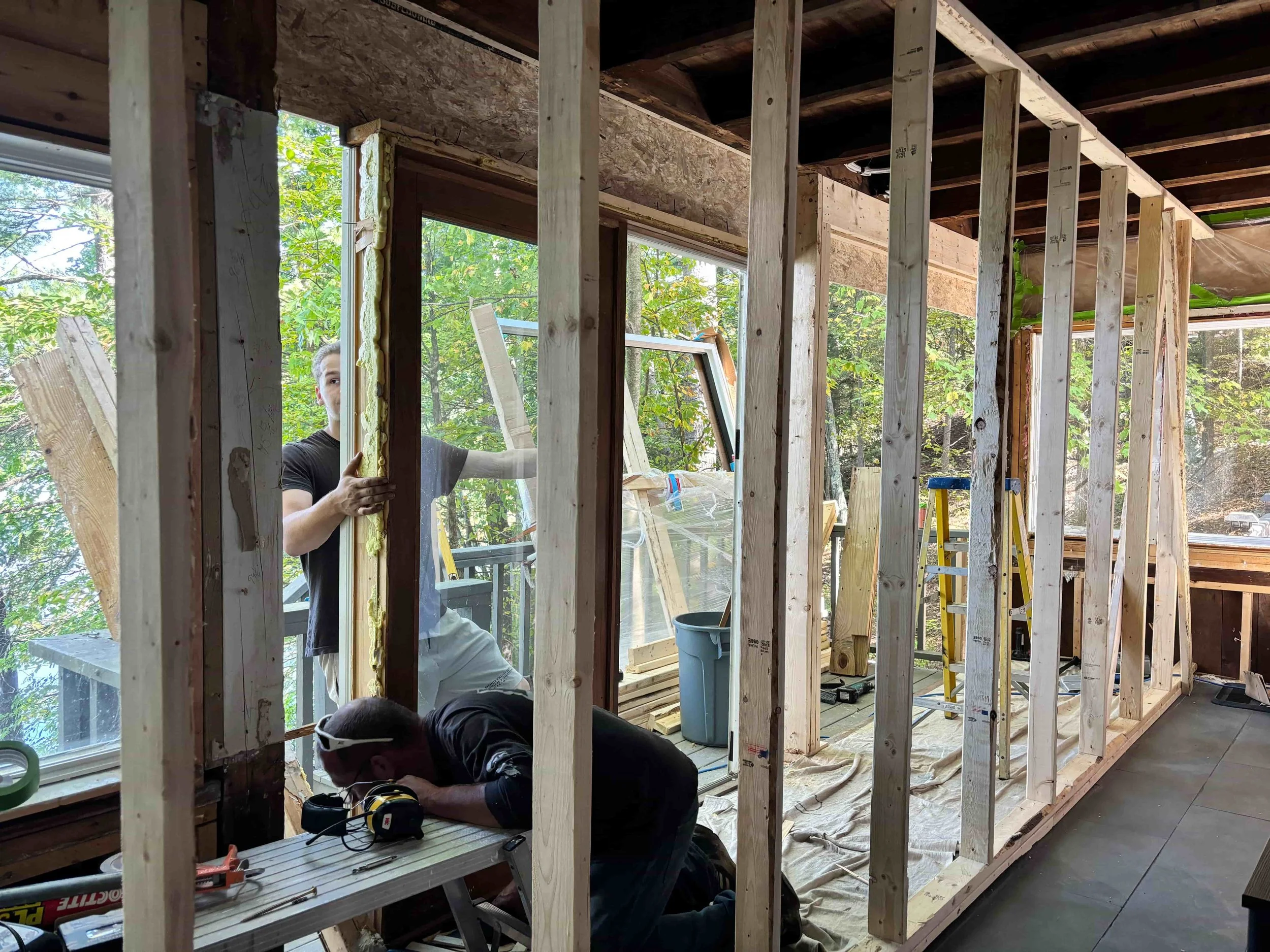 Demolition and ongoing progress of installing floor-to-ceiling windows
