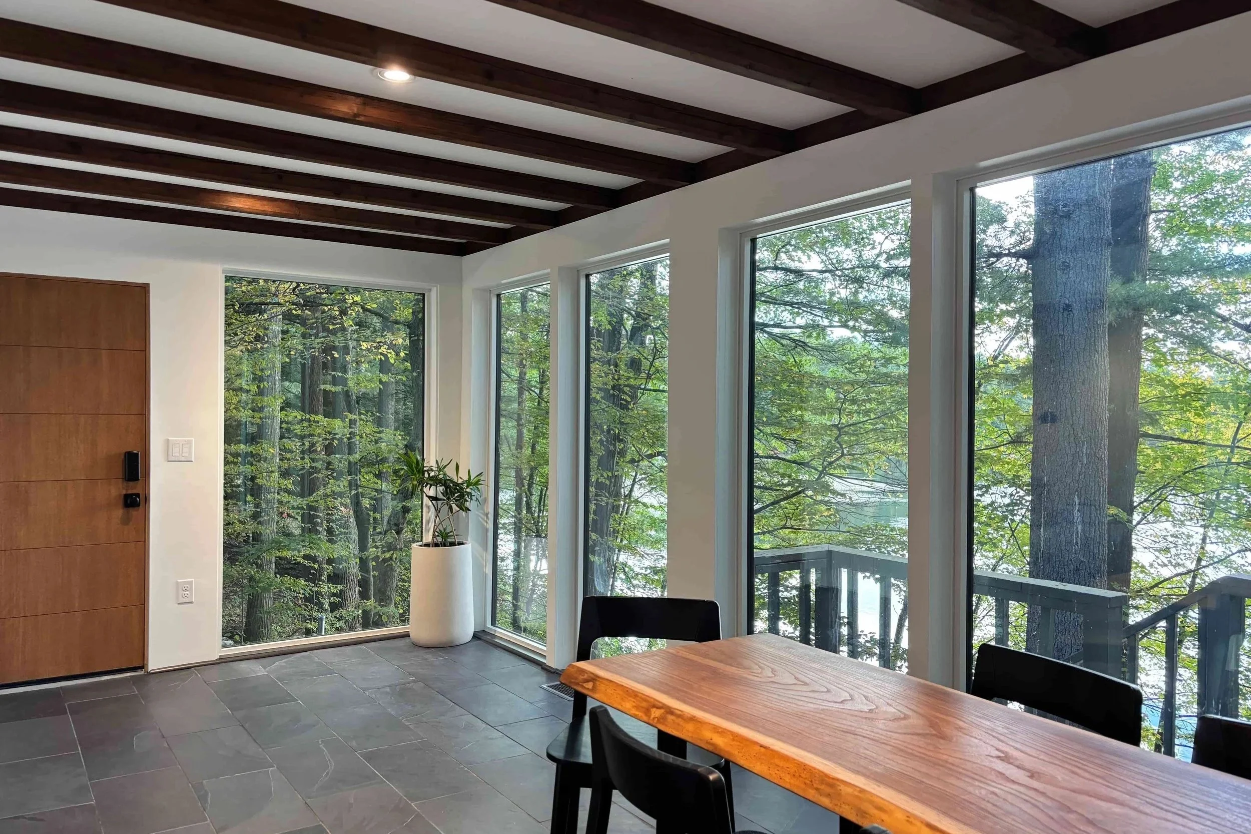 Living room with water views and floor-to-ceiling windows