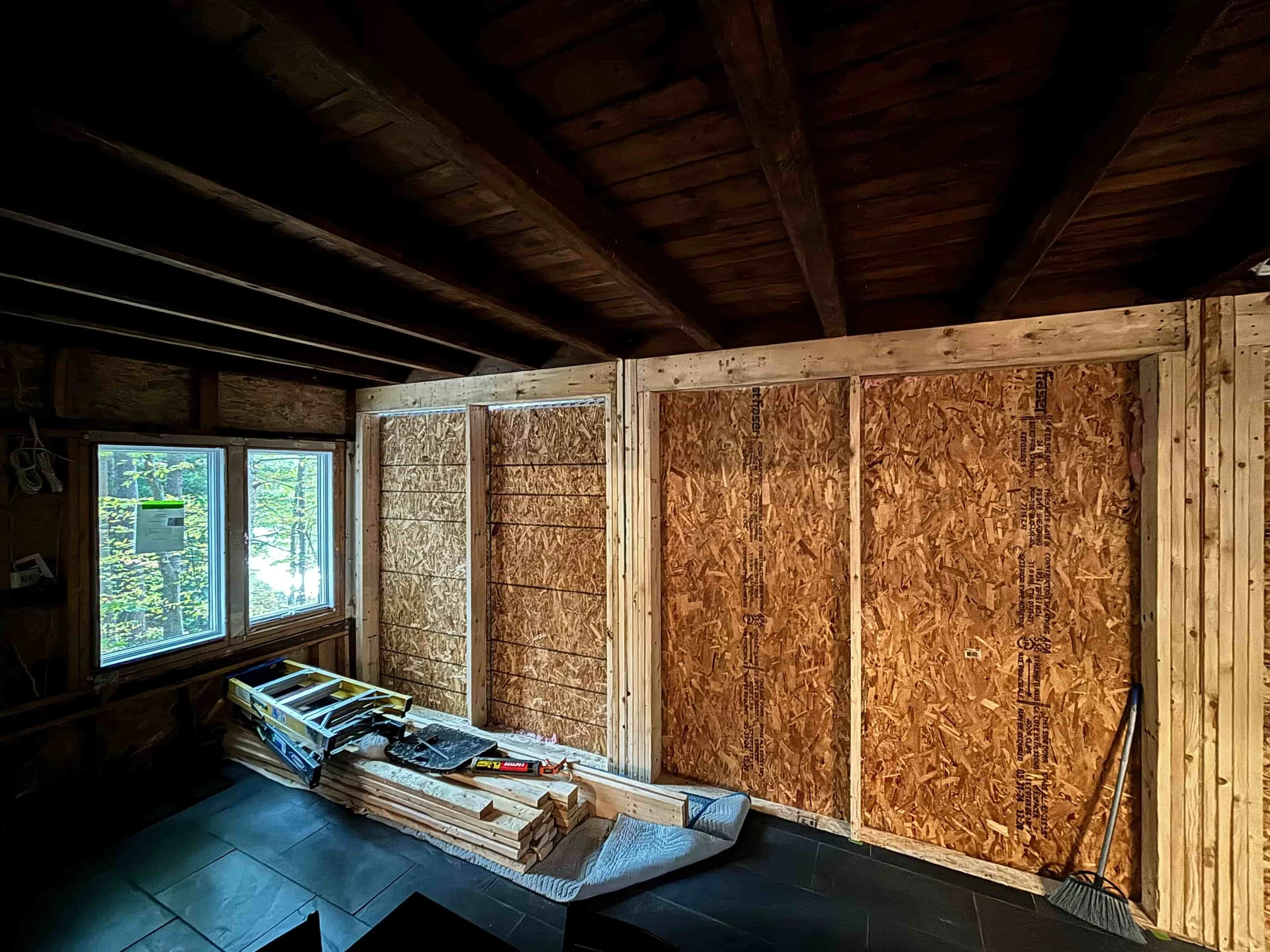 Two sections of window frame rebuilt and boarded up