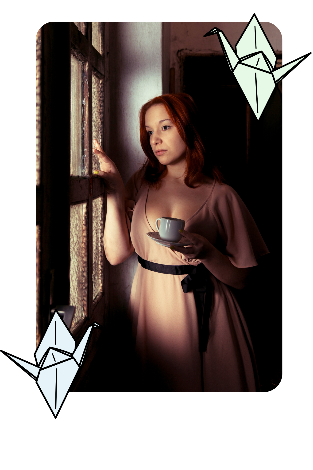 “Person standing quietly by a window with tea, appearing reflective and distant”
