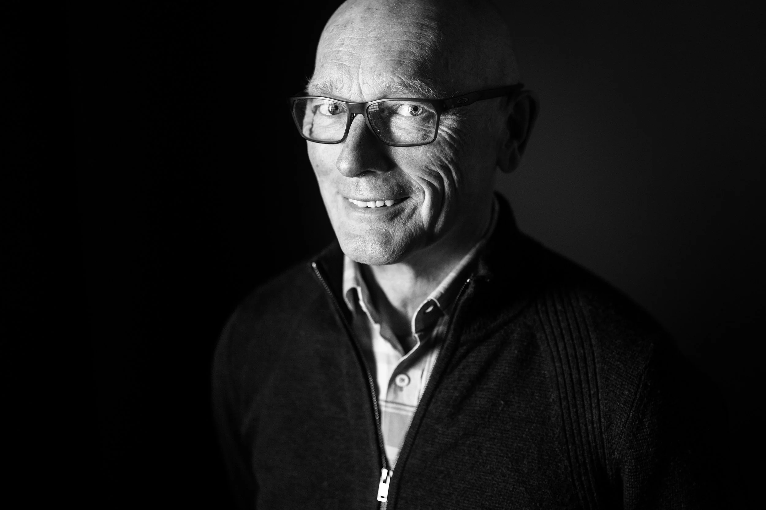 Winemaker Michael Hall up close, in black and white, stares at the camera.