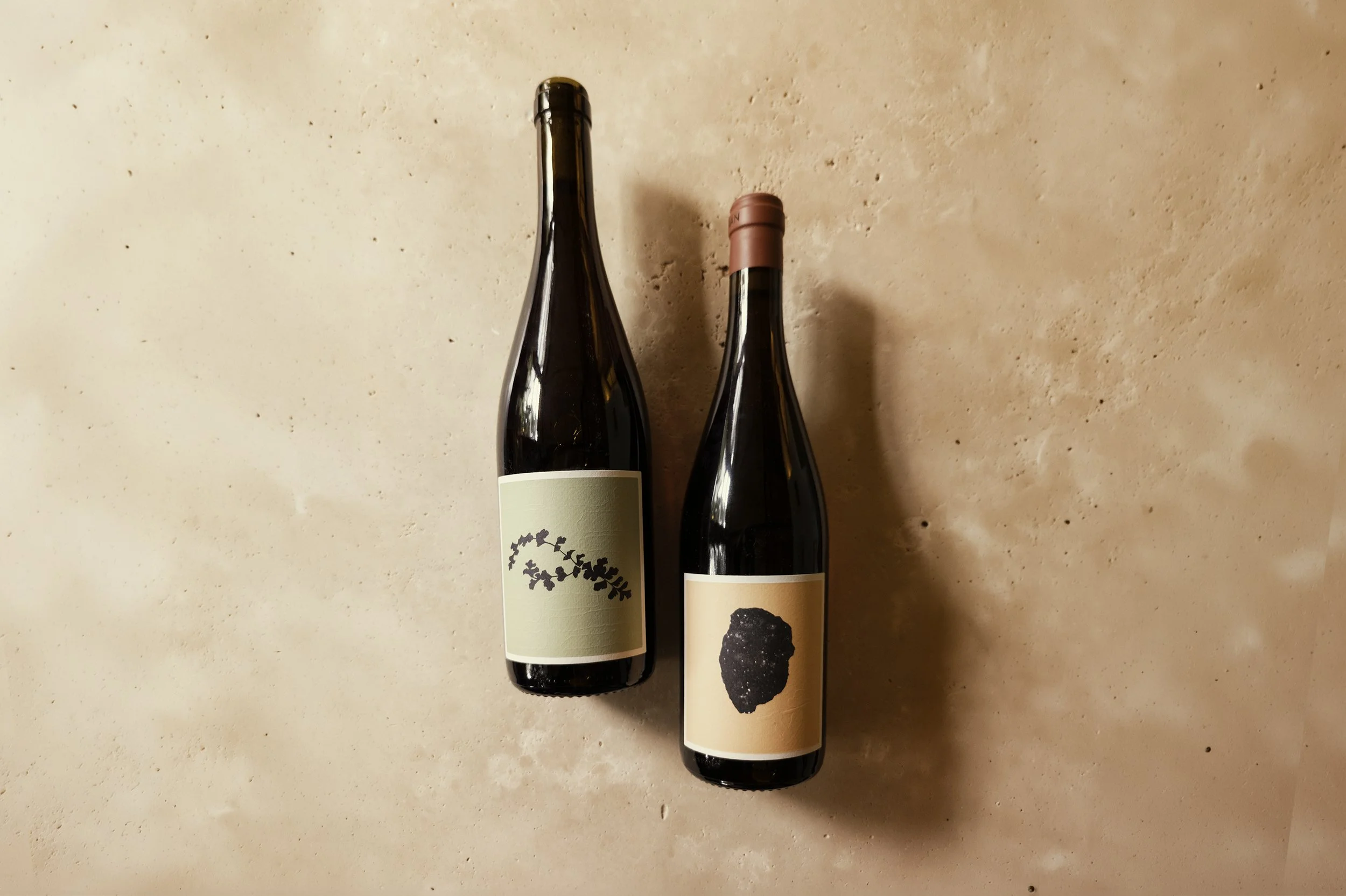Bulman Glen's Vineyard 2025 and Bulman Gary's Vineyard 2025 Grenache, resting on a stone table.