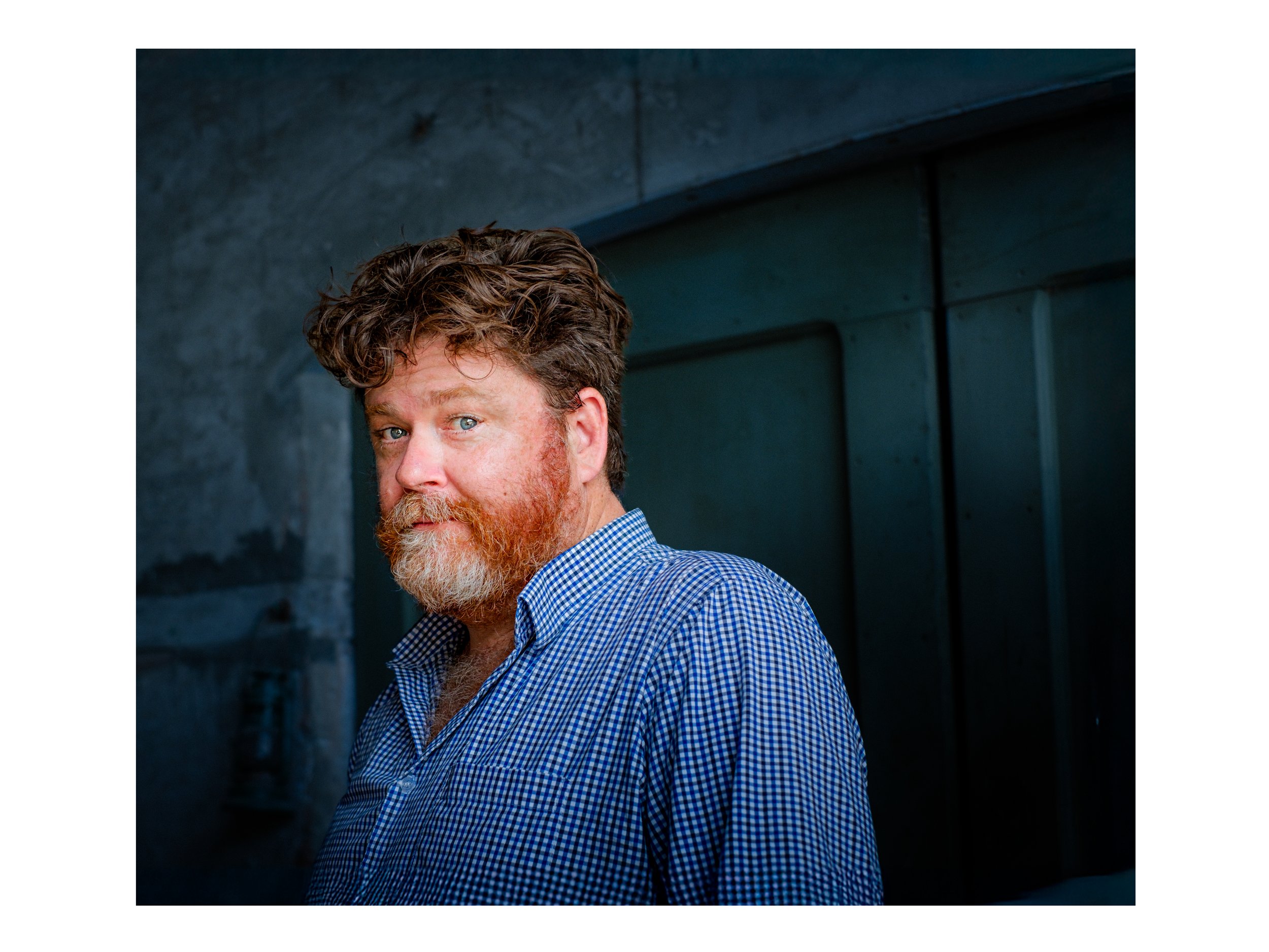 This is a portrait of wine writer Nick Ryan in the wine region of Verona in Italy. This photograph was taken by photographer Campbell Mattinson.