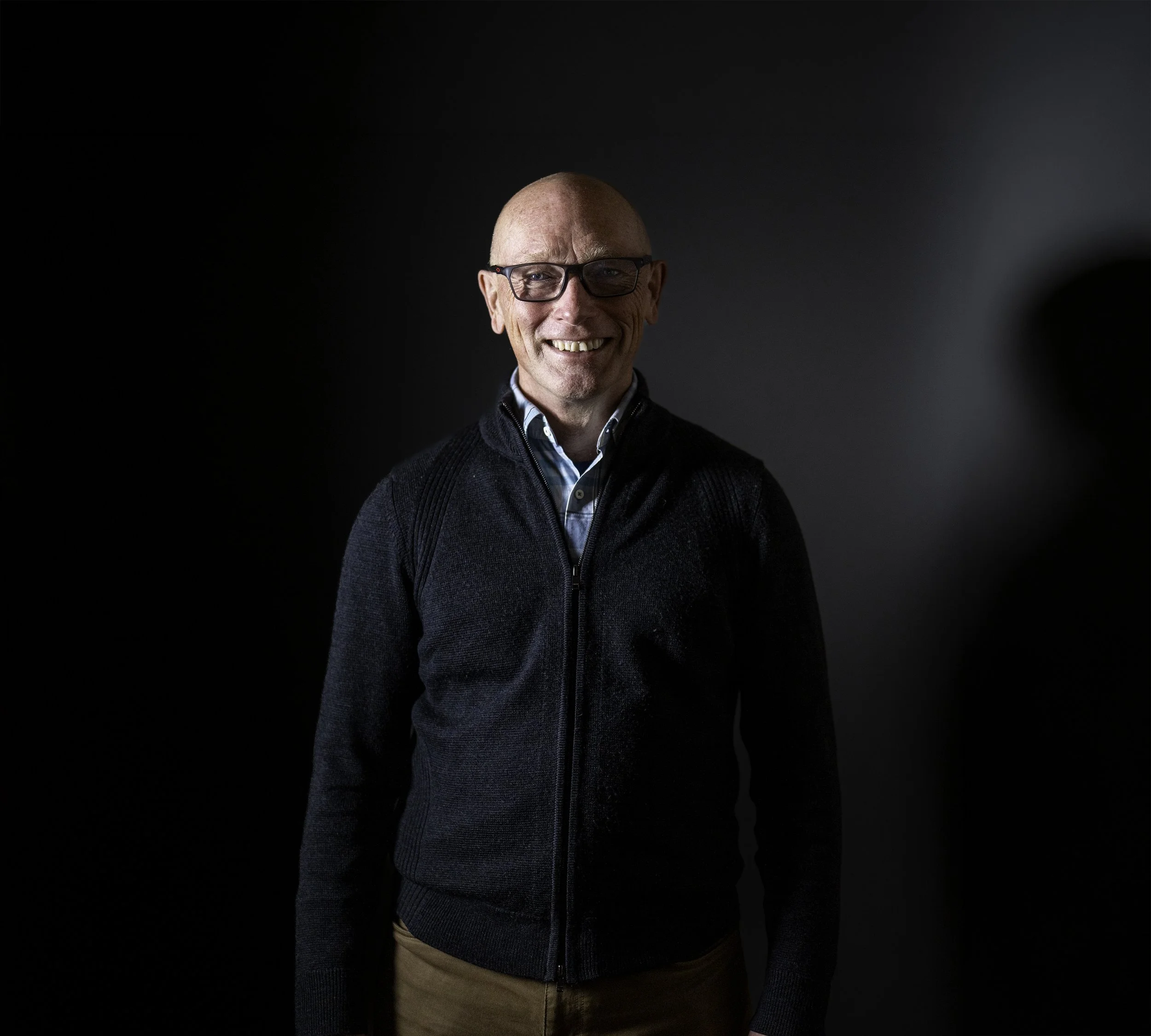 Michael Hall, winemaker, smiling at camera.