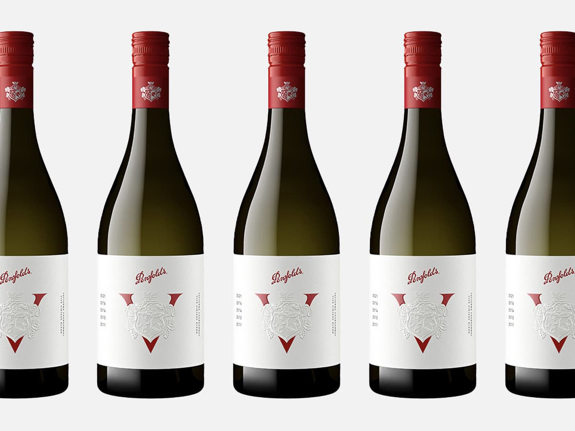 Five bottles of Penfolds Yattarna V Chardonnay lined up in a row.
