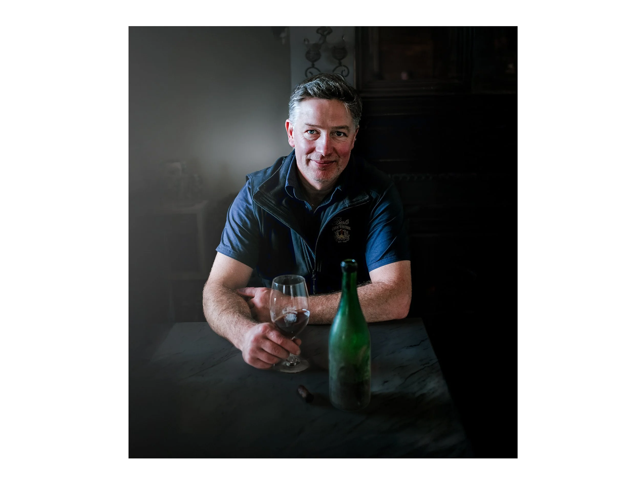 This is a portrait of winemaker Justin Purser in the wine region of the Grampians in Victoria. He is wearing the vest of Best's Wines, where he made wine at the time. This photograph was taken by photographer Campbell Mattinson, and is copyright Camp