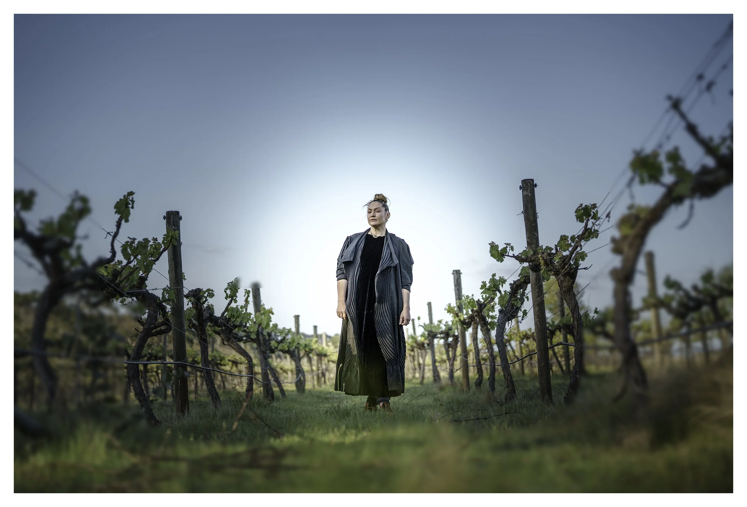 Winemaker Sierra Reed standing in her vineyard.