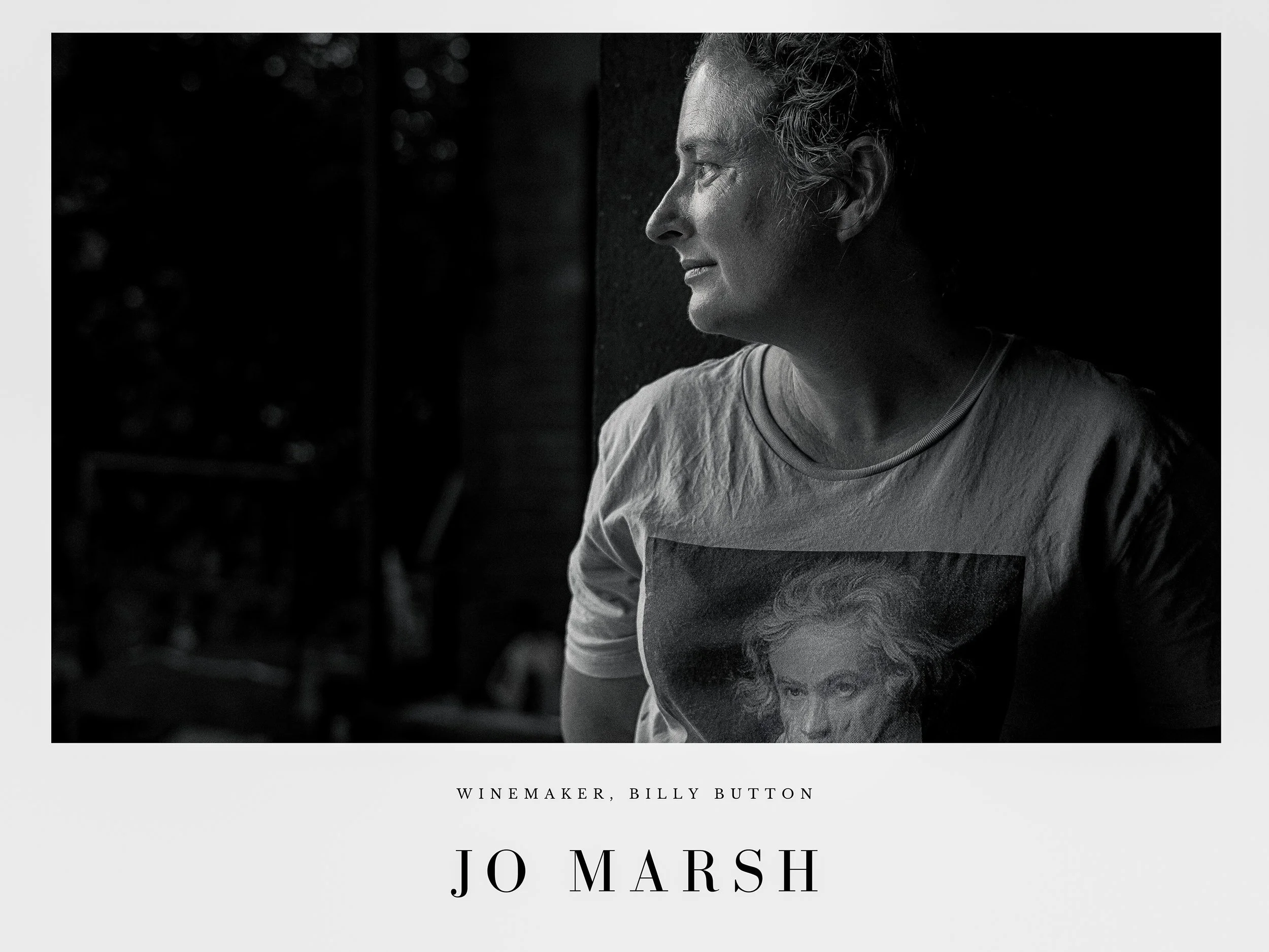 Black and white photo of winemaker Jo Marsh in profile, looking to the right, wearing a T-shirt with a portrait on it. Text below reads: "Winemaker, Billy Button, Jo Marsh."