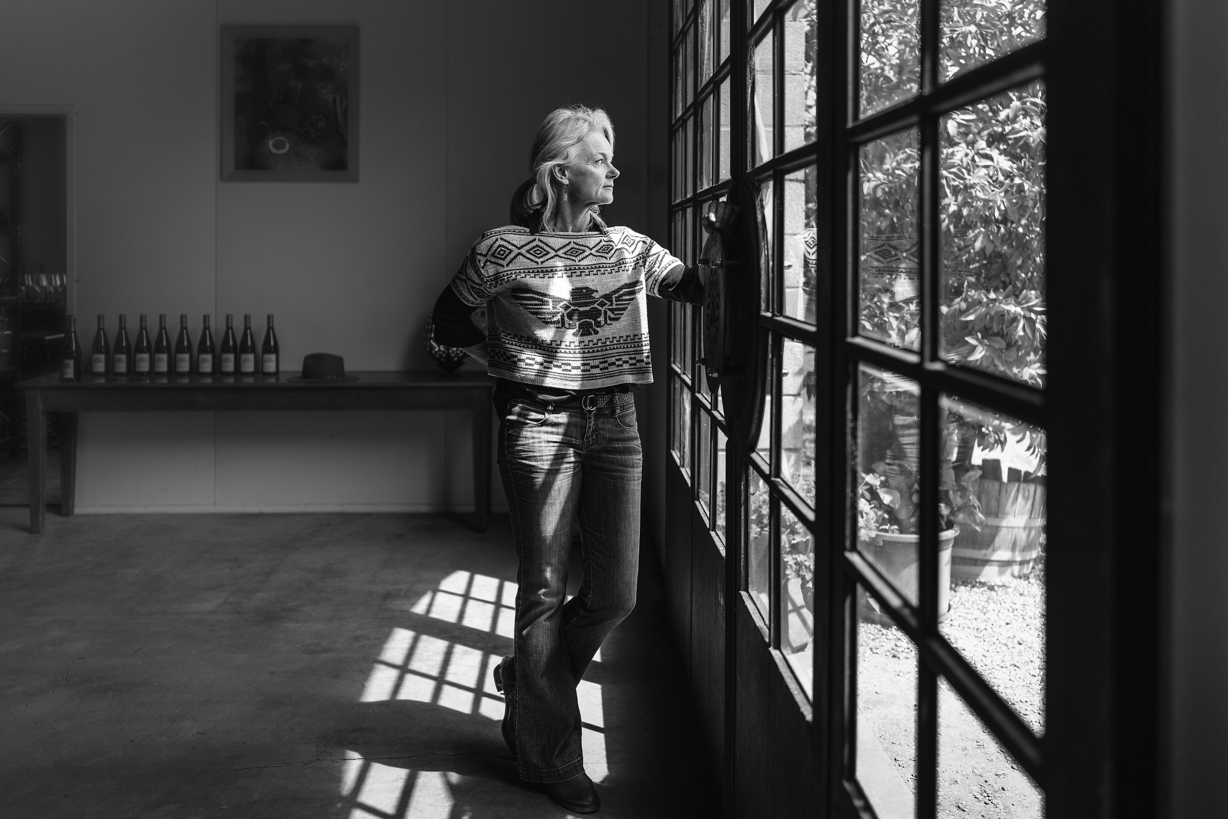 Eleana Anderson of Mayford wines looks out the window of the Mayford winery.