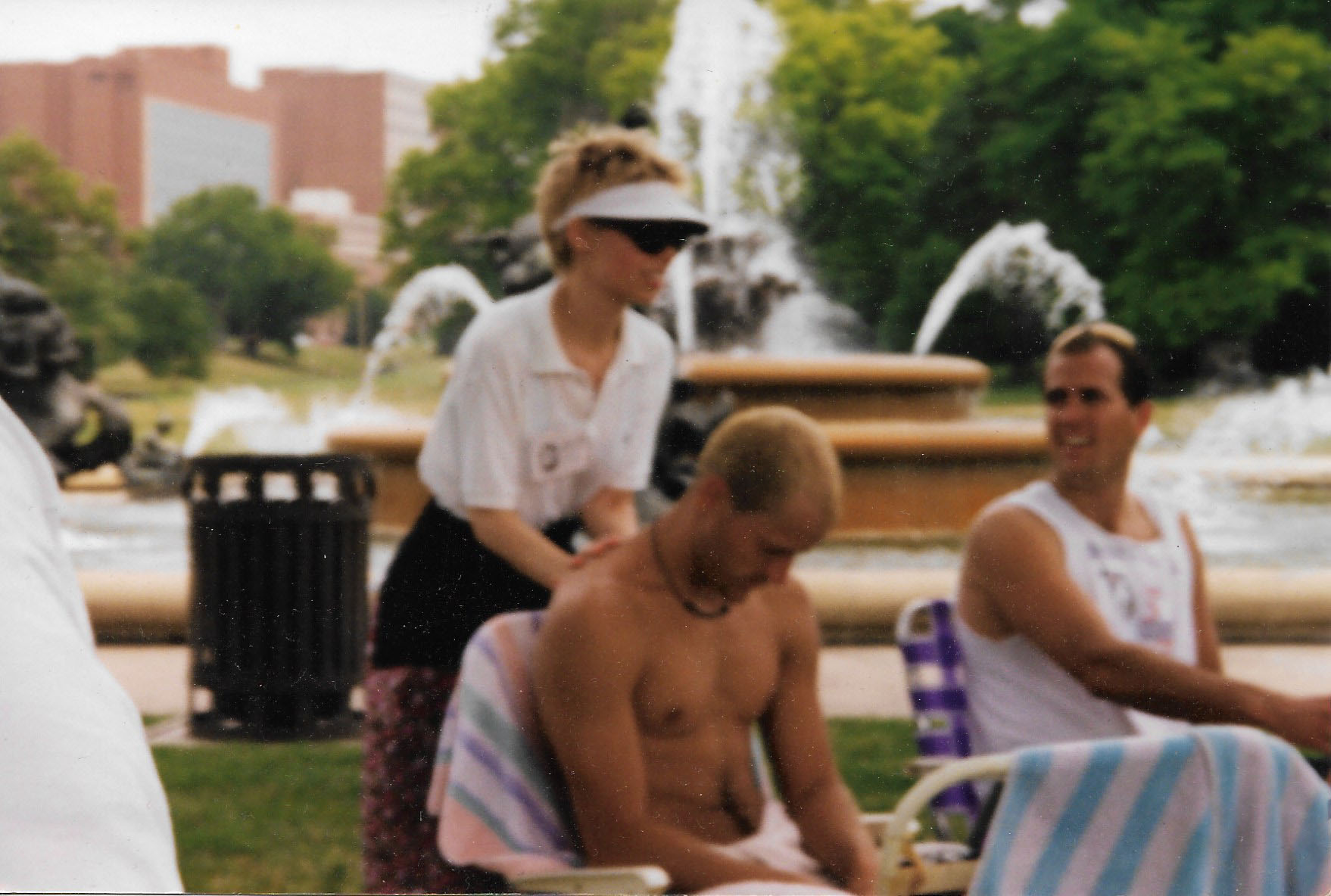 Here is a photo of the owner of Solaris Massage during Massage Awareness Week back in 1997 at Mill Creek Park, KCMO. How ‘bout that visor?