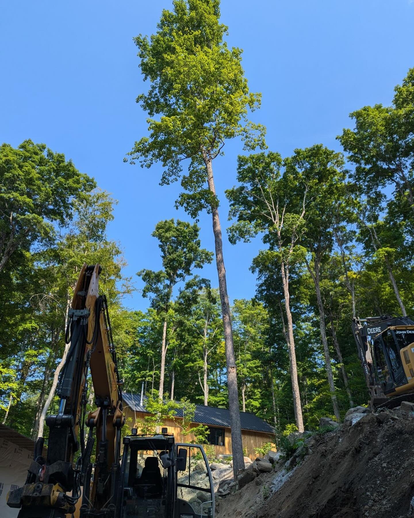 Our view for the week 🌳🌤️

We&rsquo;re working on an interesting retaining wall in a beautiful location. More photos to follow! 

#homeconstruction #ottawavalleyliving #cottagecountry #cottagecountryontario #groundworks #heavymachinery #canadiancon