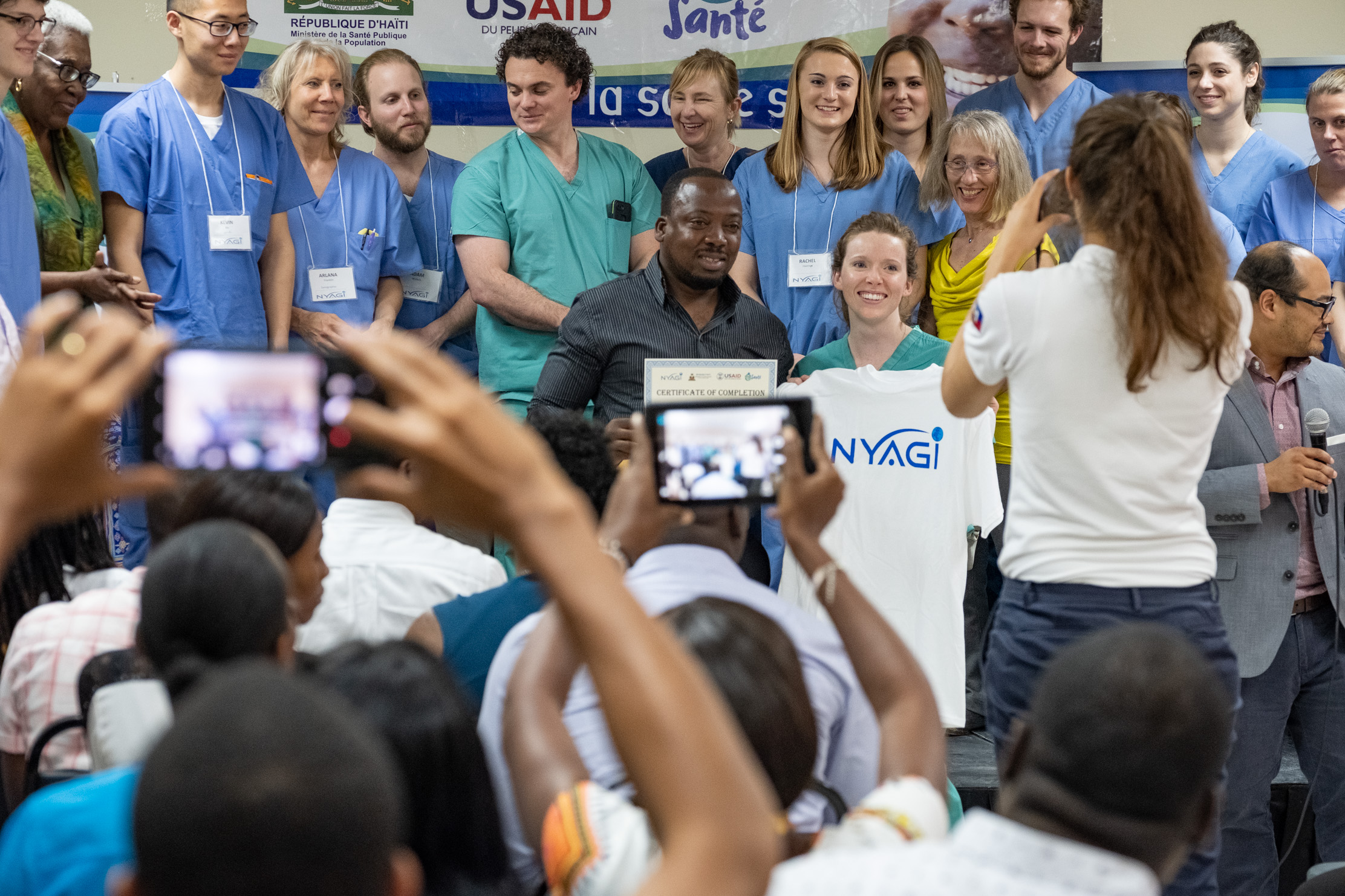 Certificates and t-shirts are handed out to each participant by the NYAGI team.