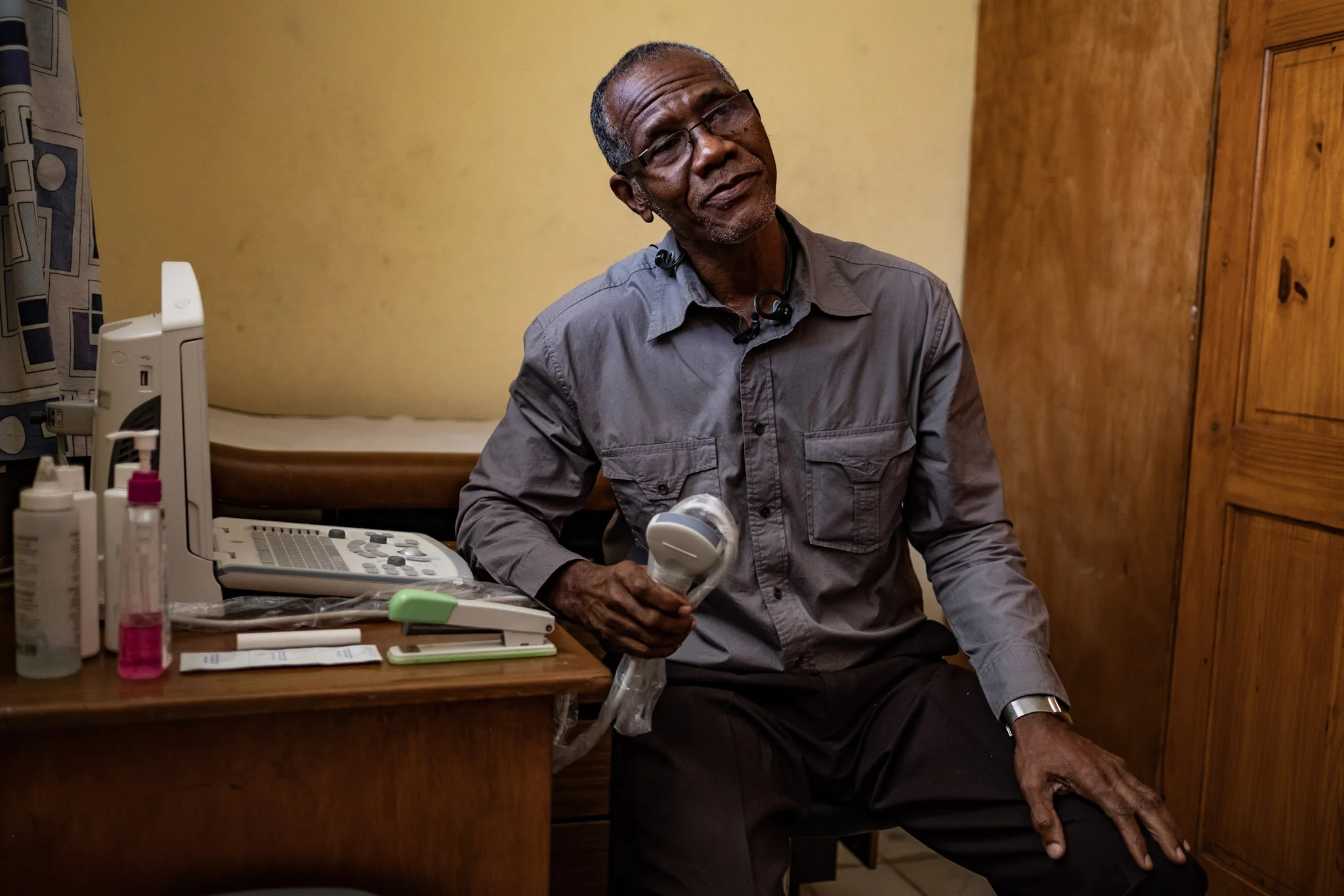 Dr. Arold Scutt with his new ultrasound machine in his clinic, Centre Medico-Social Petite Place Cazeau, in Haiti.