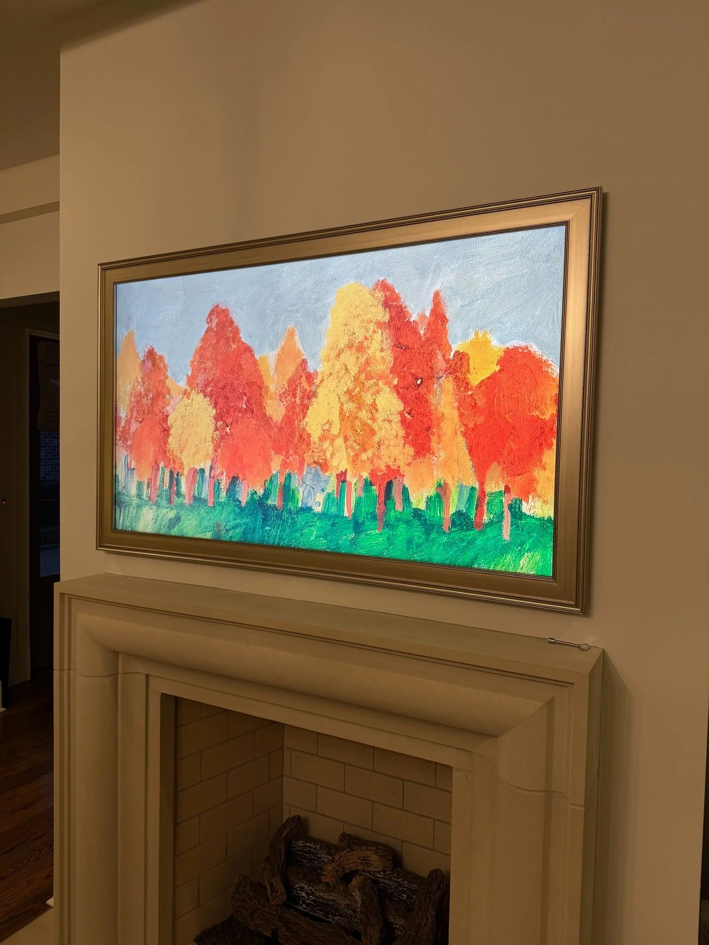 Seeing how a custom frame and artwork make a TV blend into a space never gets old.