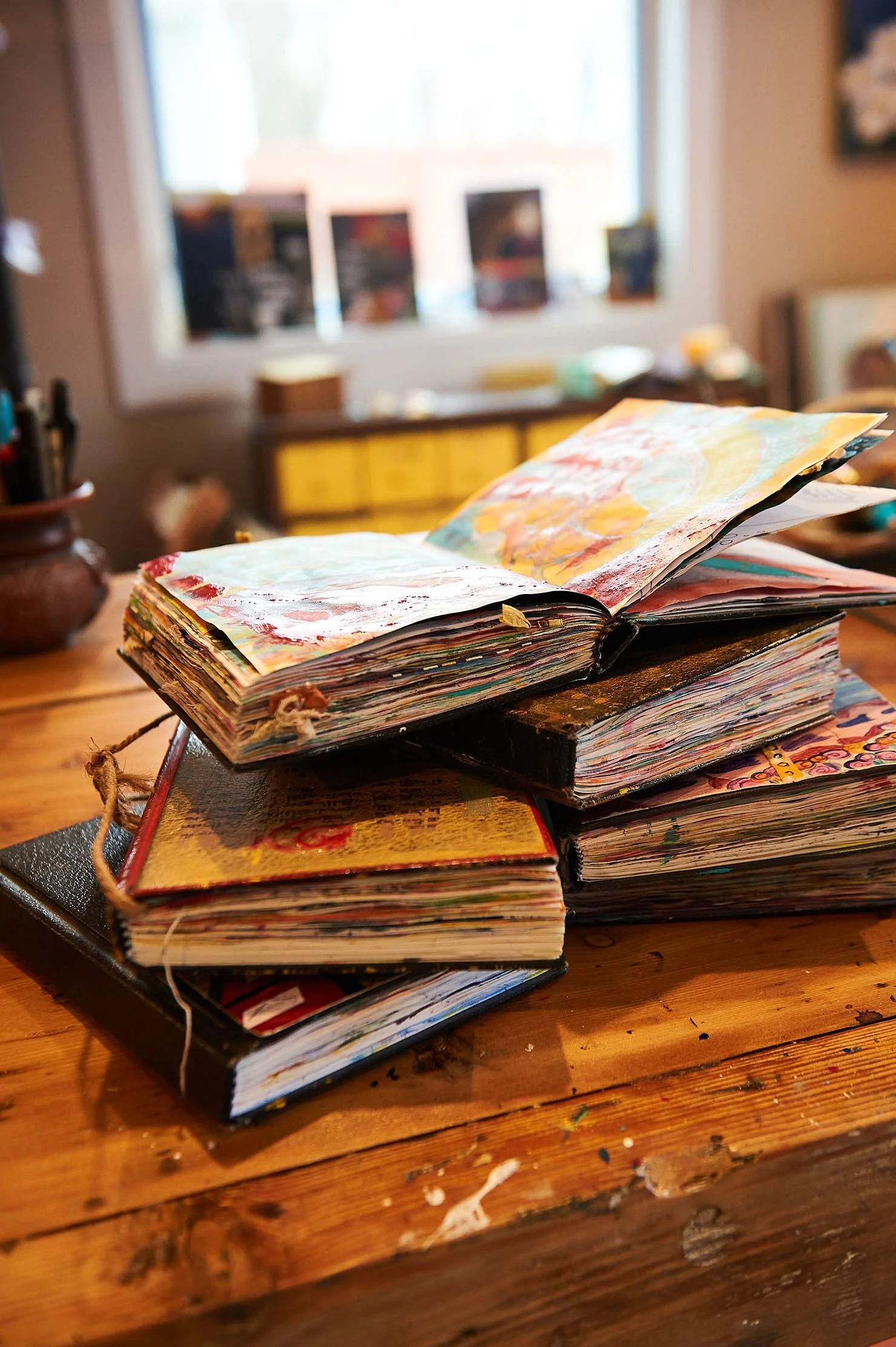 stack of journals with one open.jpg