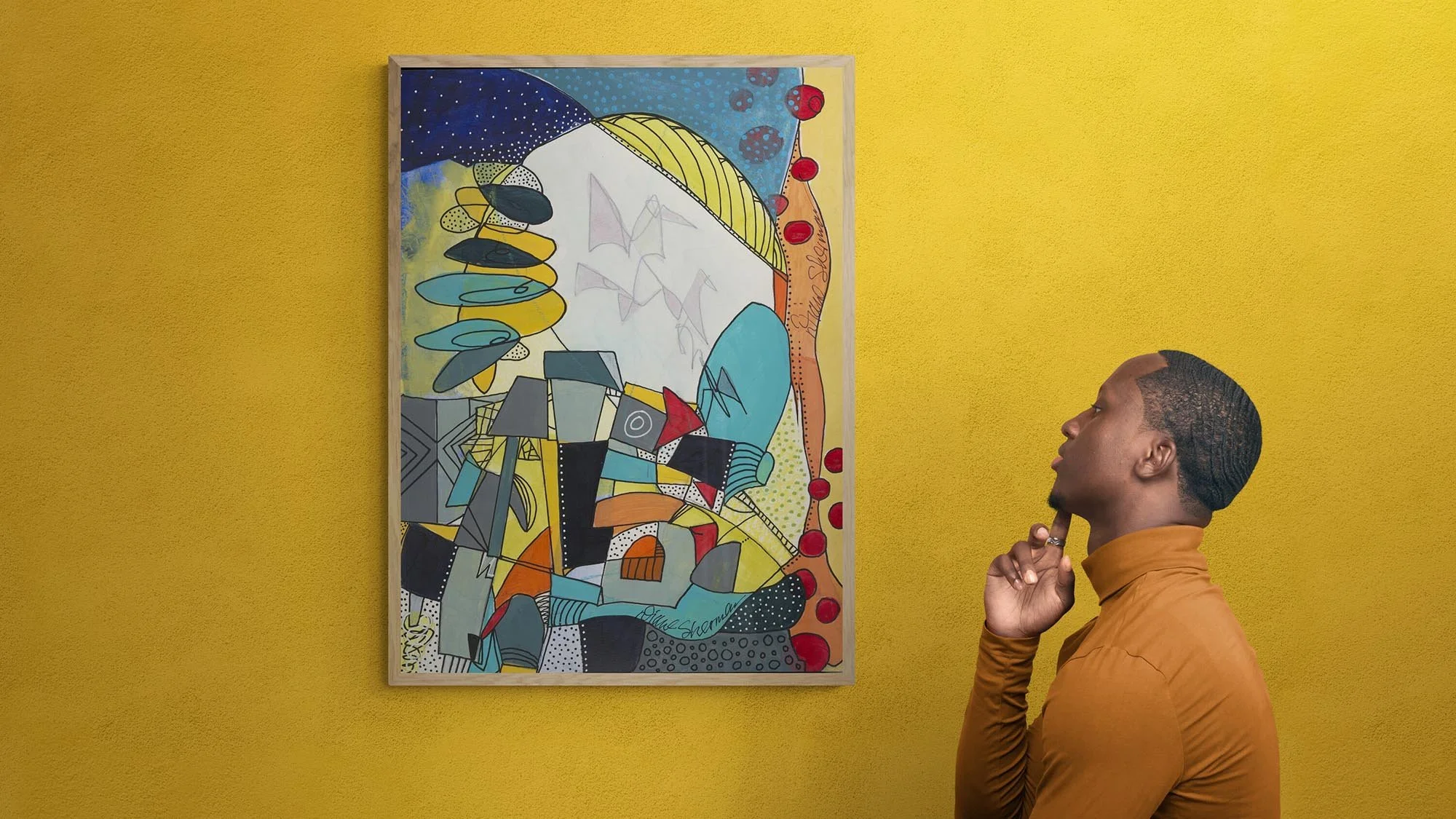 young-man-next-to-gallery-wall copy.jpg