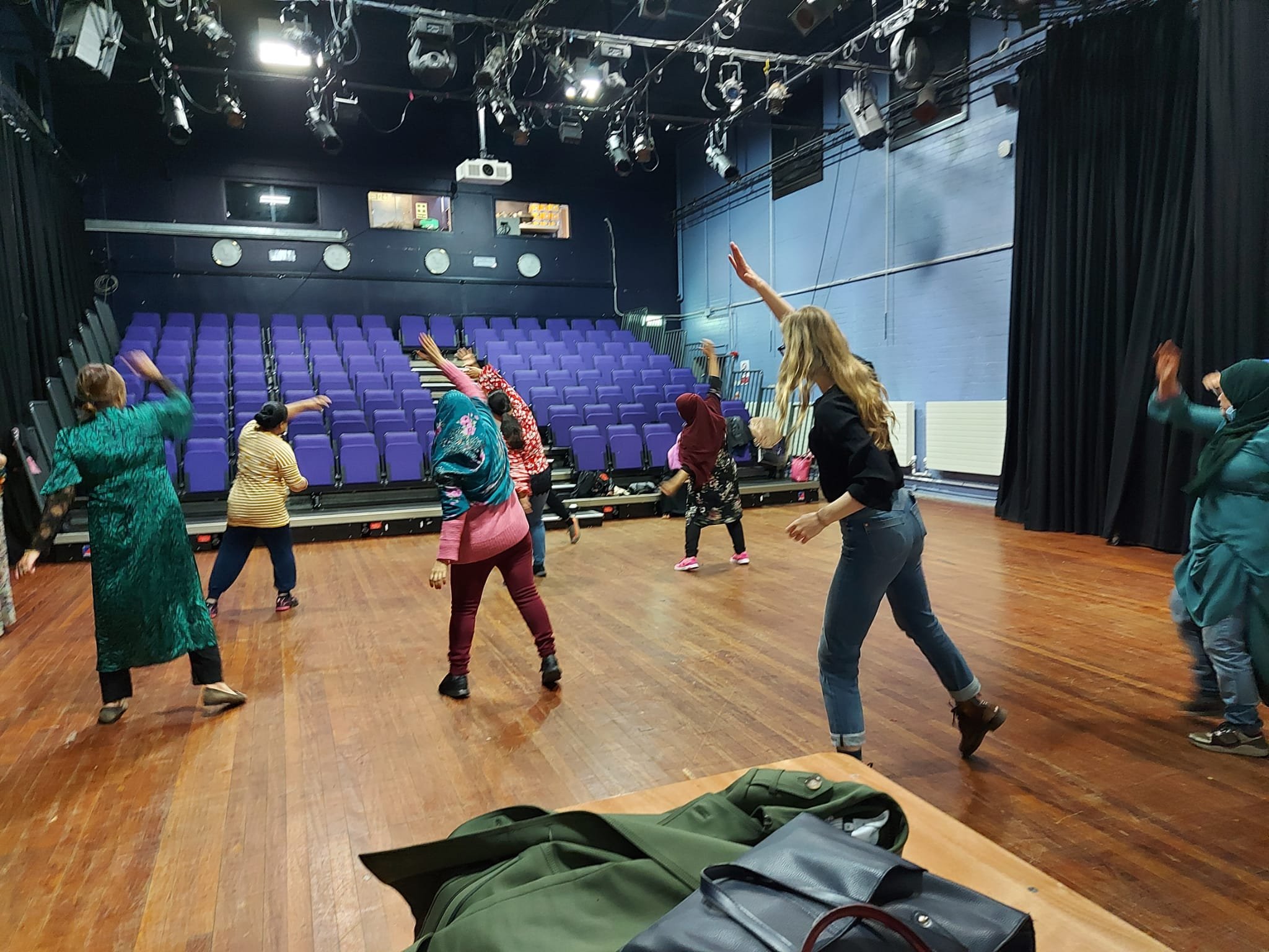 Group_of_women_exercising_in_Brady_theatre.jpeg