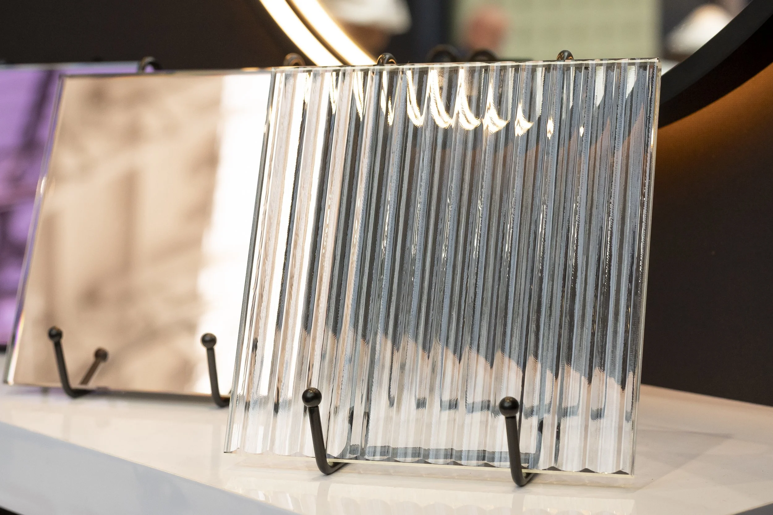Close-up of ribbed bronze and clear glass tiles on stands_Abbey Glass (Cardiff) Limited