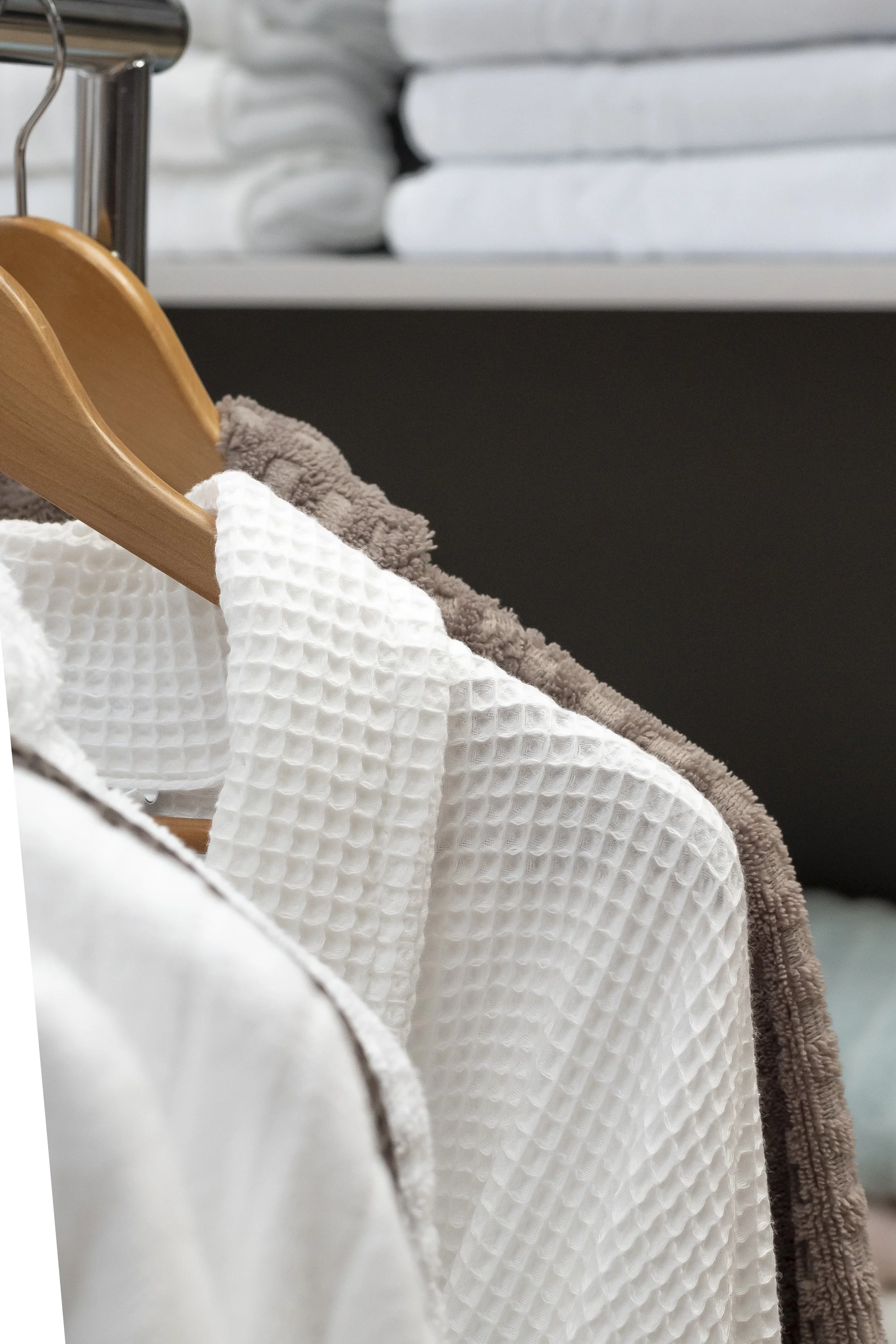 White waffle robes hanging on a rail_Cliveden House and Spa
