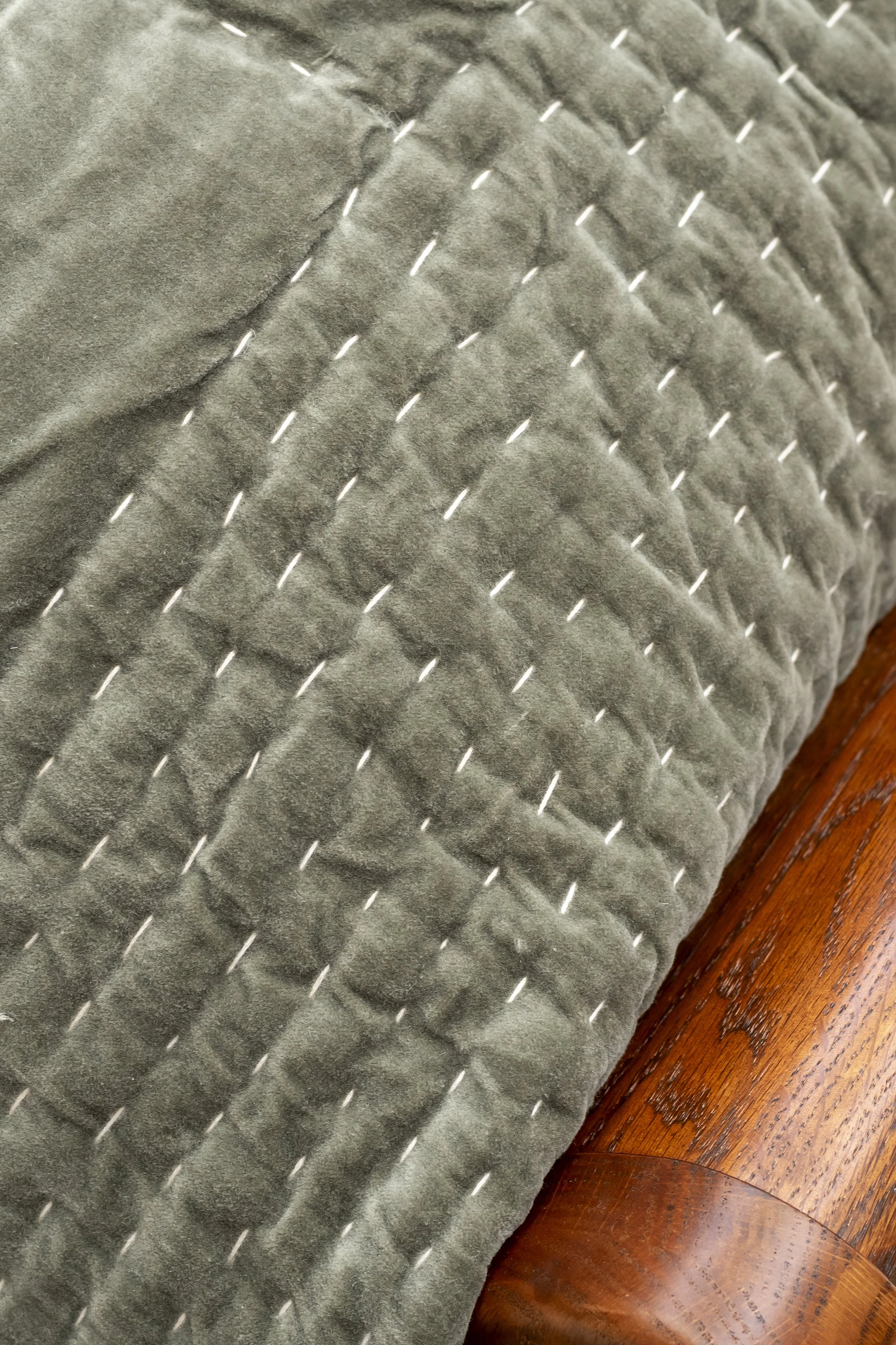 Quilted sage green throw_The Cotswold Company | B Corp™