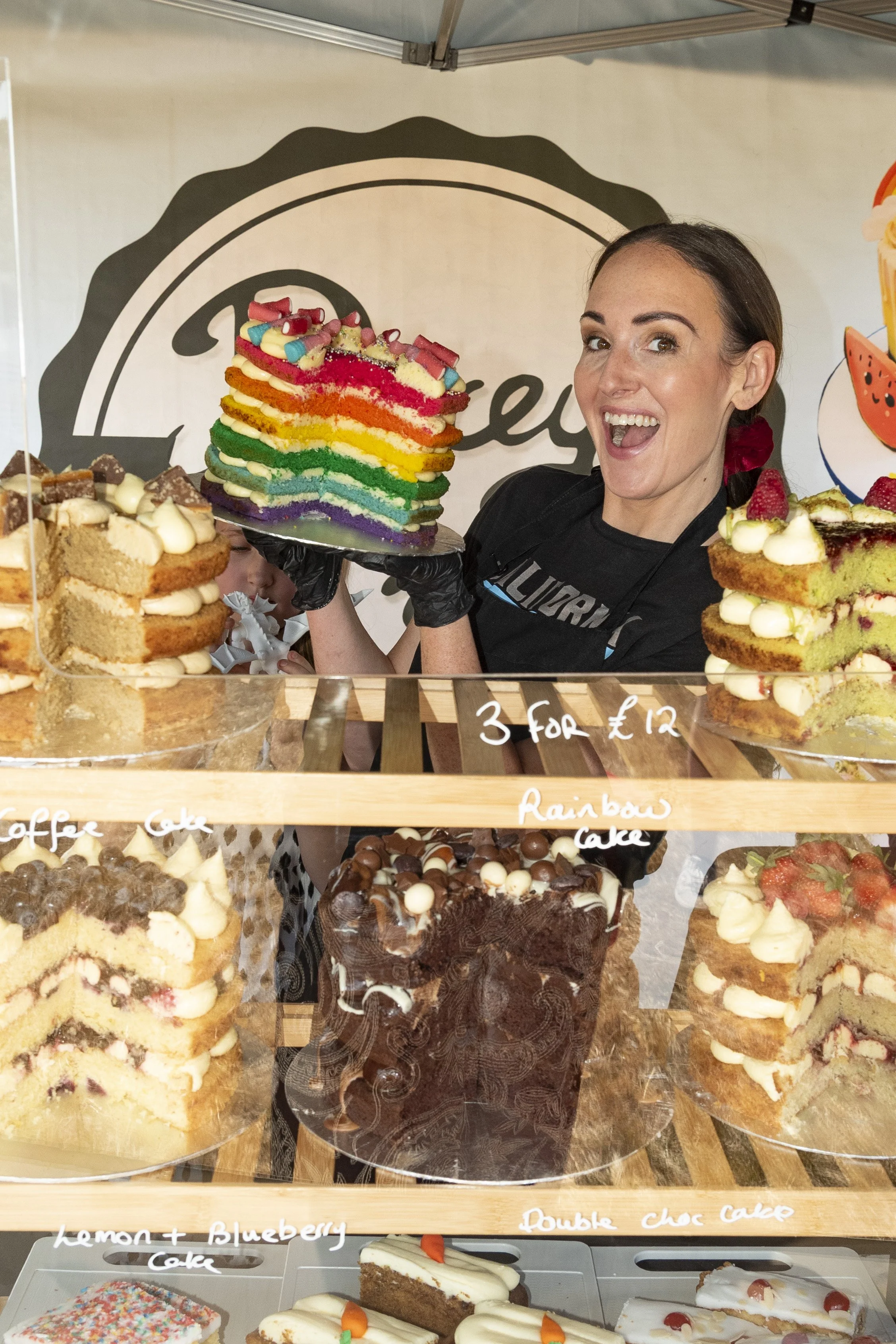 Event food stall vendor demonstrating culinary prep at the Great British Food Festival 