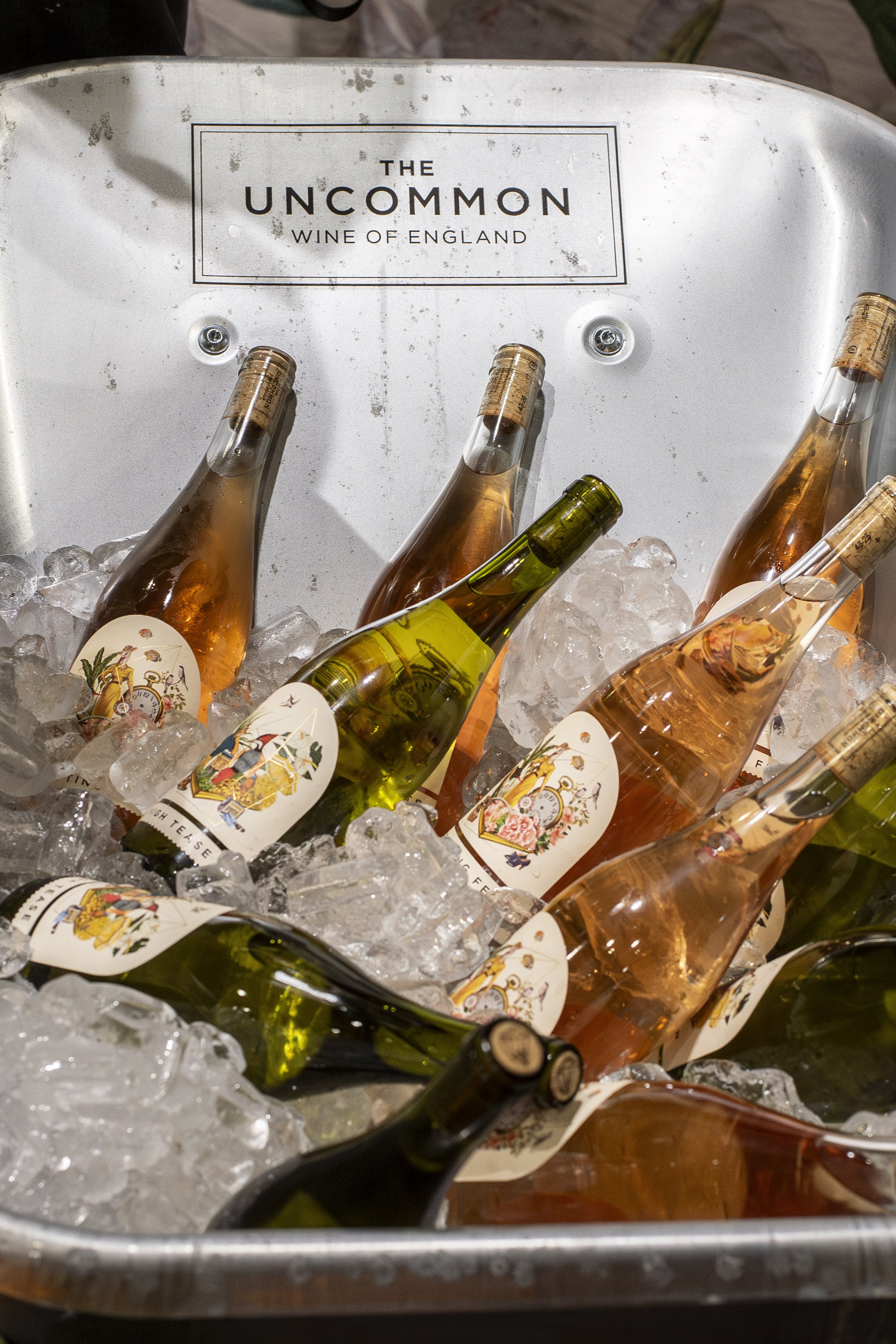 Bottles chilling in an ice bucket on The Uncommon stand