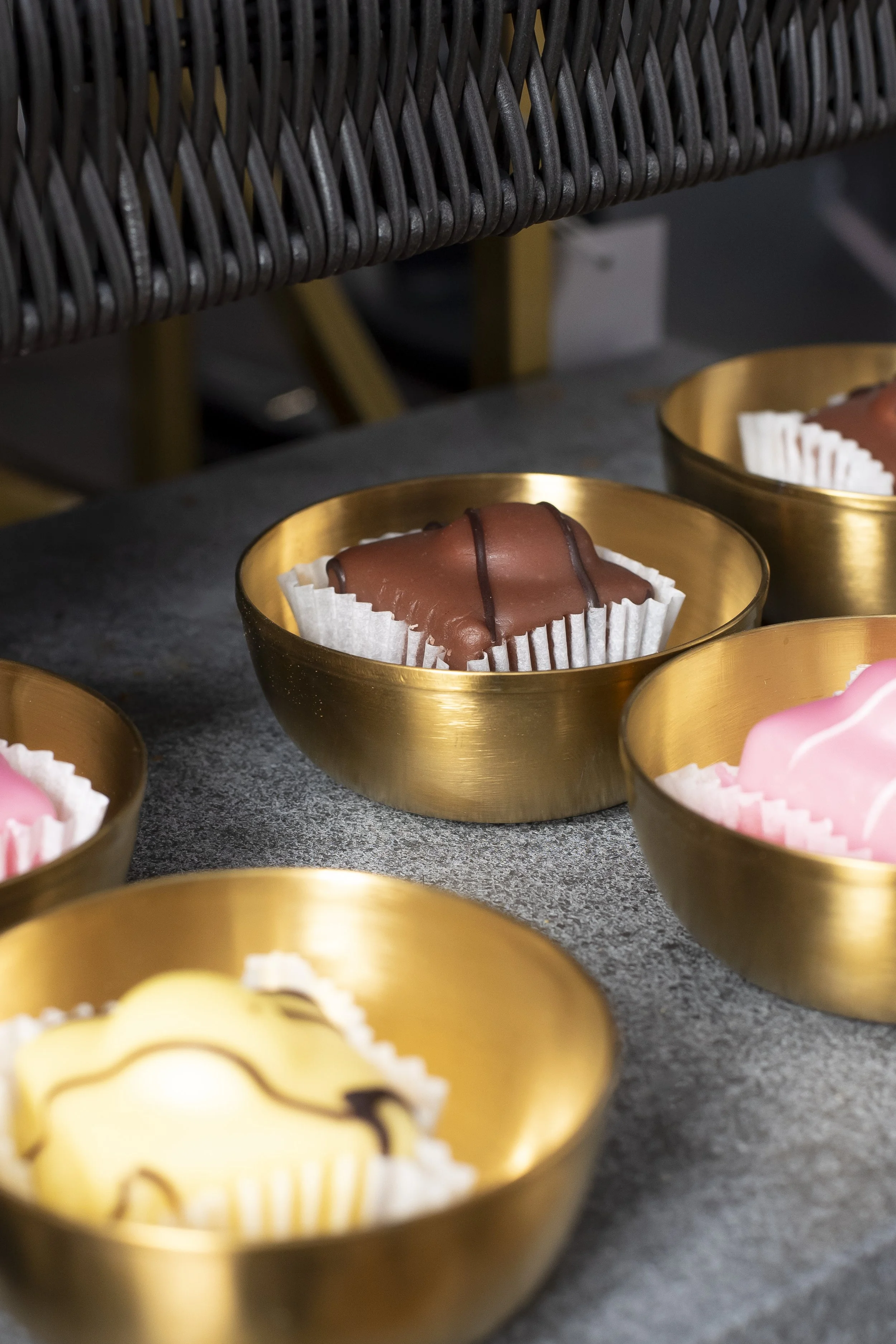 Brass bowls with sweets on a grey tray_HG Stephensons Ltd