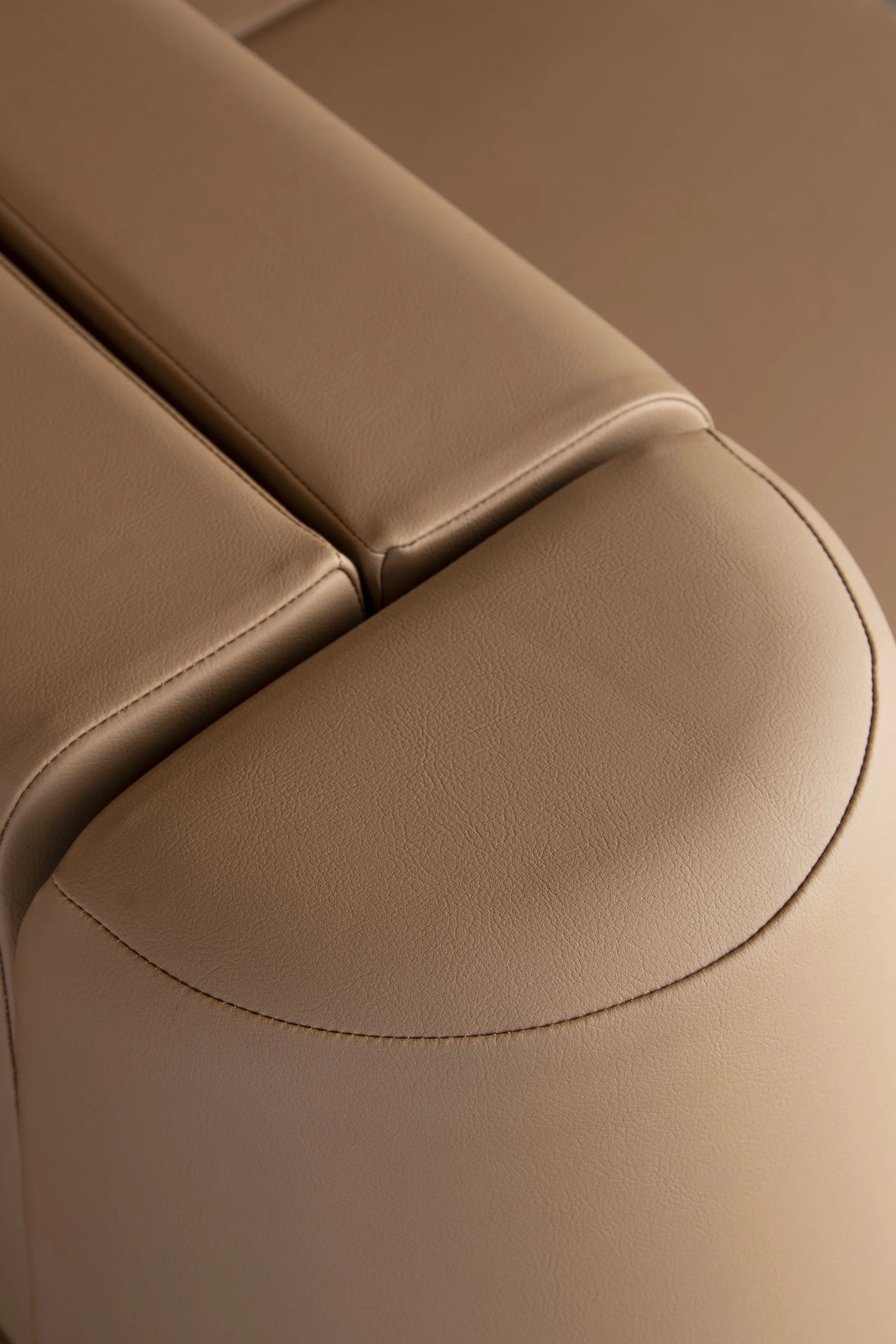Close-up of tan leather upholstery detail