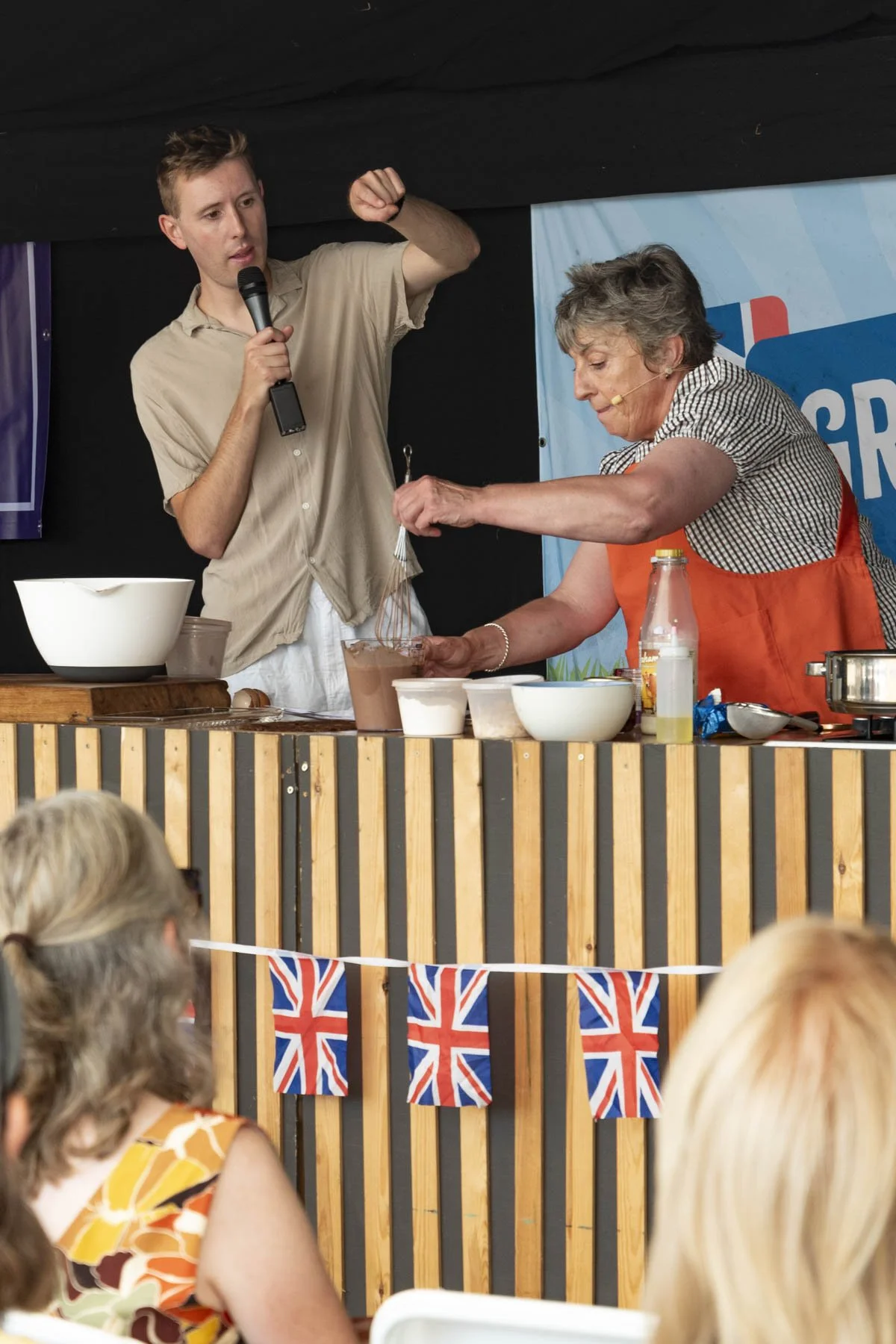 Event food stall vendor demonstrating culinary prep at the Great British Food Festival