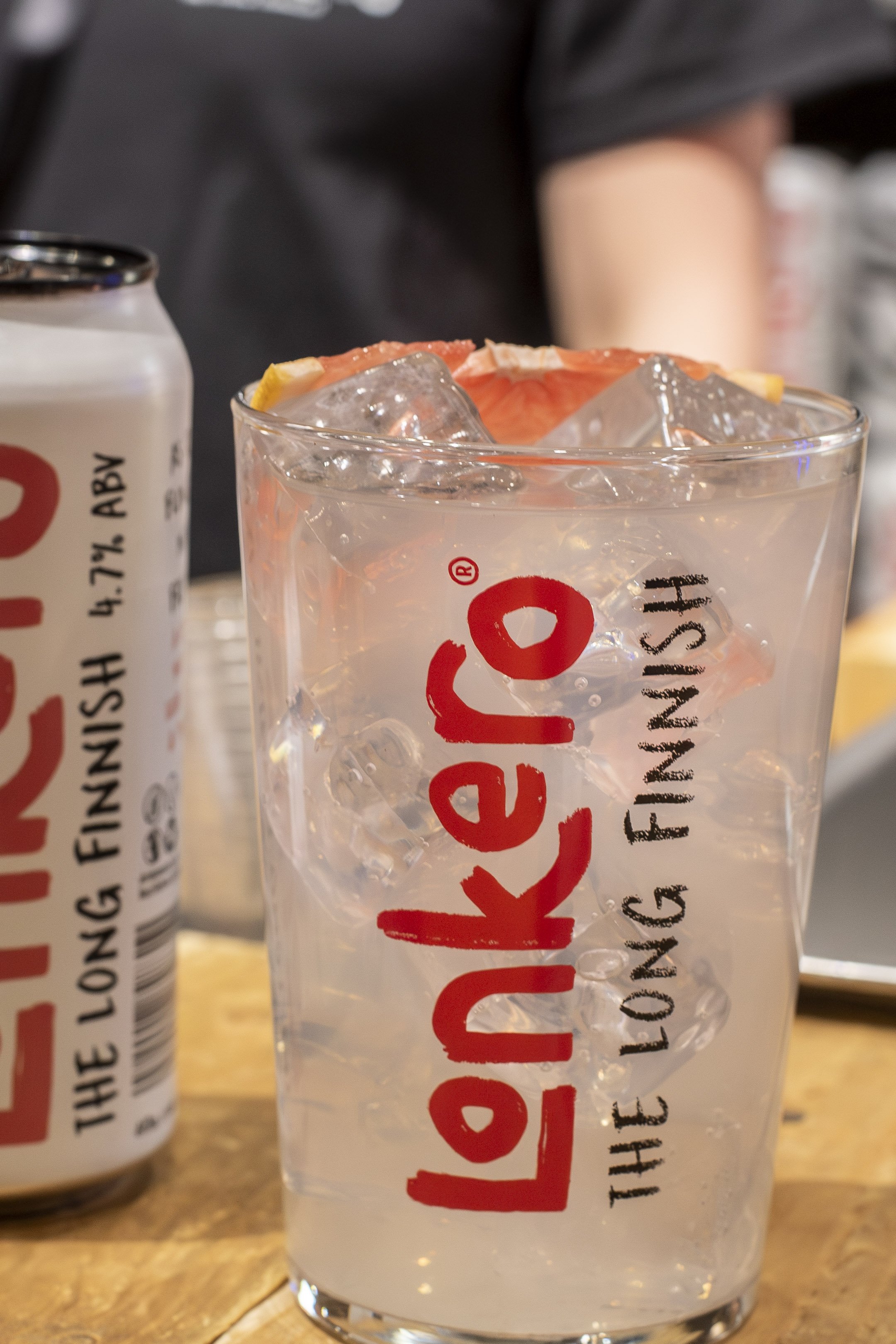 Lonkero Long Finnish can beside a grapefruit long drink in a glass