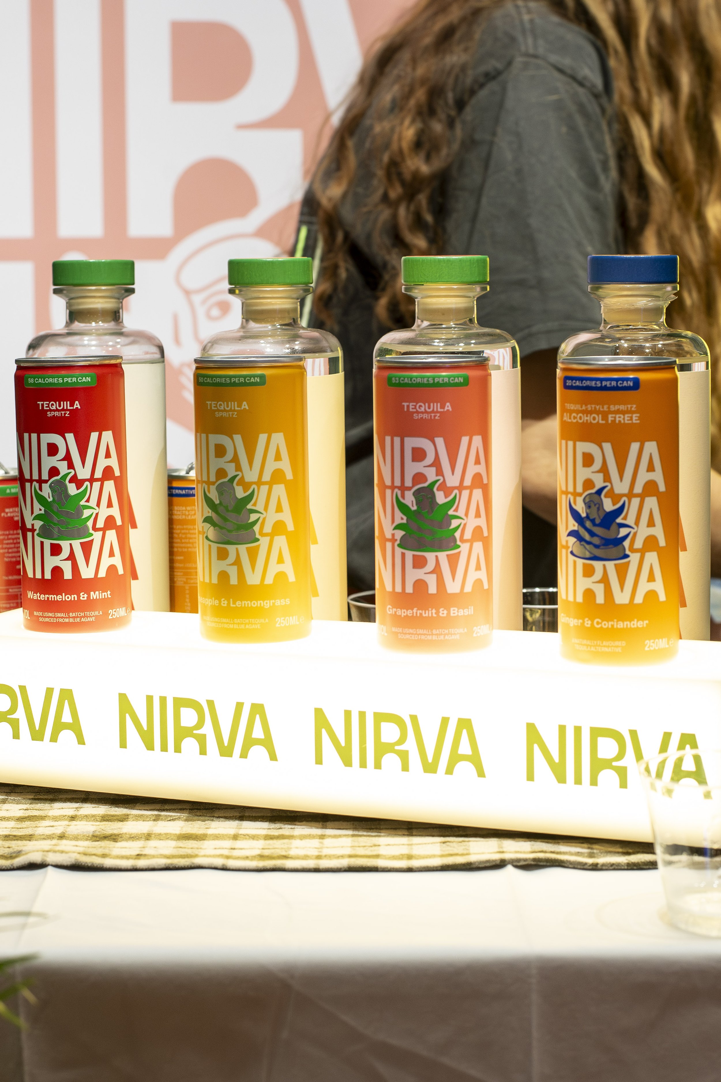 Row of Nirva drinks bottles on an exhibitor table