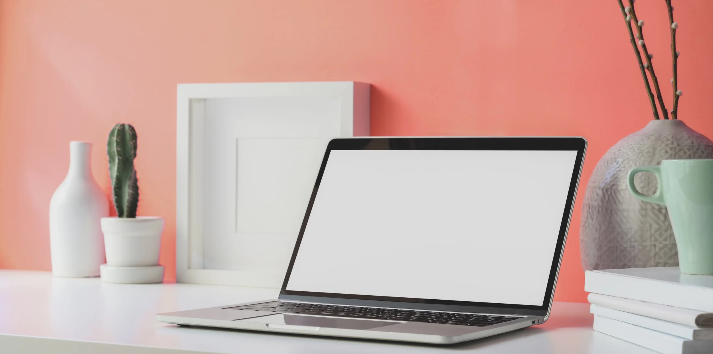 laptop-beside-peach-color-wall-3759099.jpg