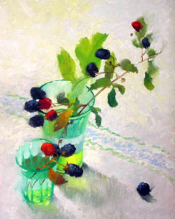A depression-glass filled with blackberries on the stem