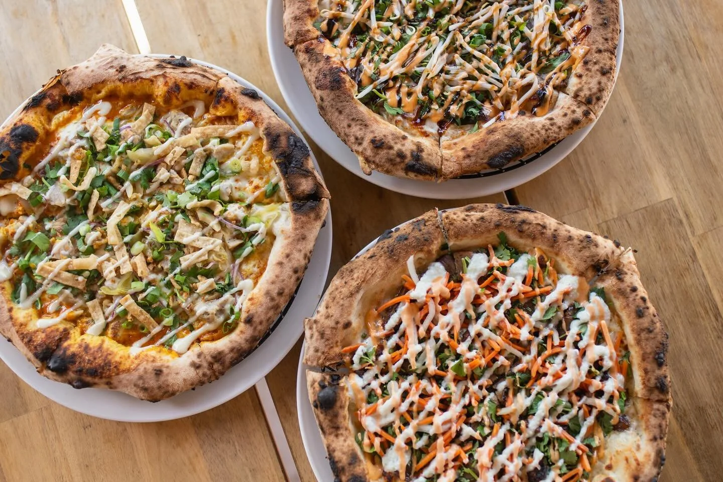 The 3 musketeers&hellip; aka our 3 most popular and crowd favorite pizzas &mdash; Banh Mi, Pho, and Khao Soi (v). Which one is your favorite? 🍕