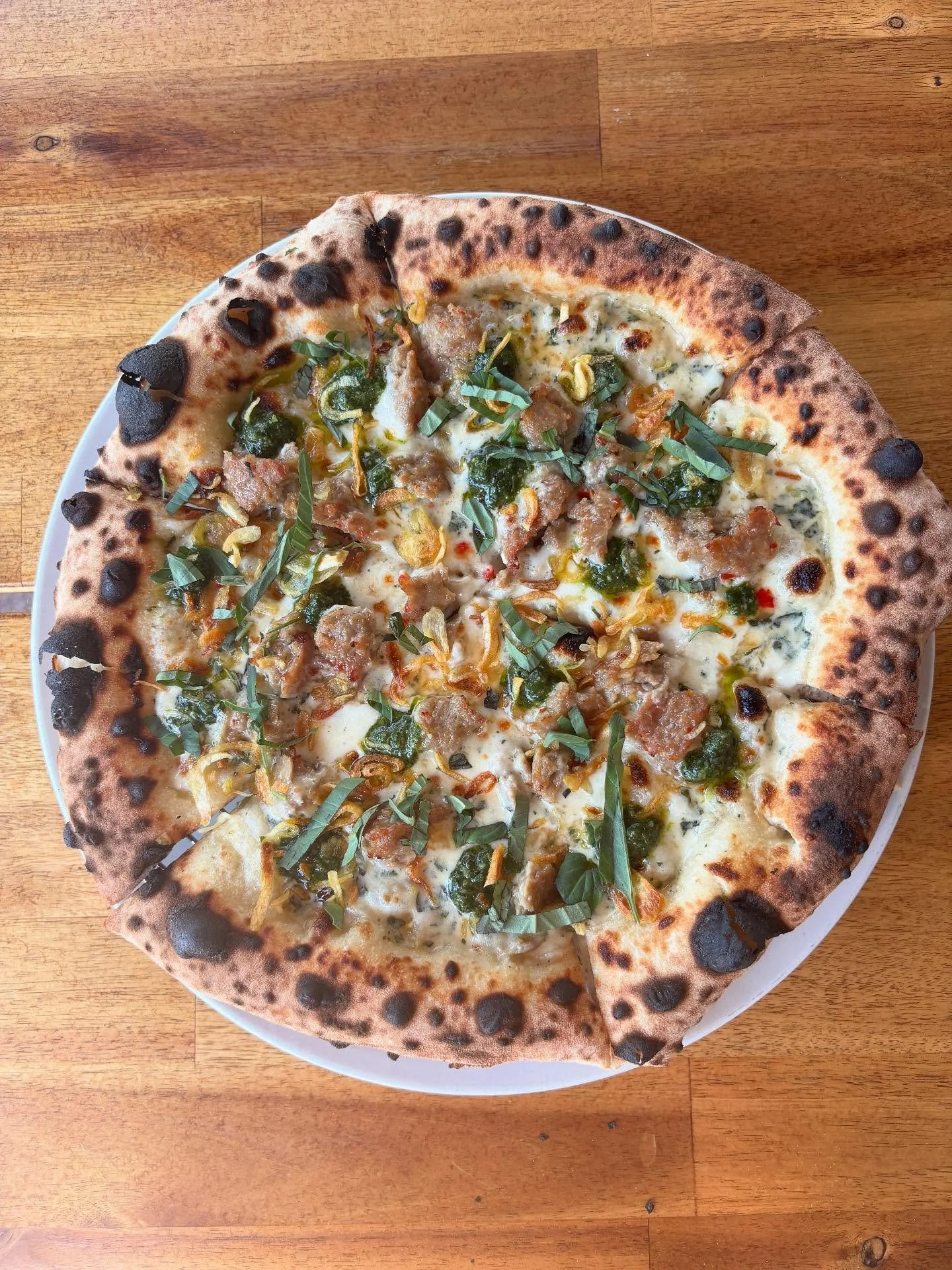 Our newest pizza &mdash; Kaprao Pizza

// House Thai Kaprao sausage, basil cream sauce, mozz, prik nam pla, fried shallots, fried basil pesto, holy basil

Our creative take on the popular Thai spicy stir-fry dish. It&rsquo;s bold, spicy, creamy, and 