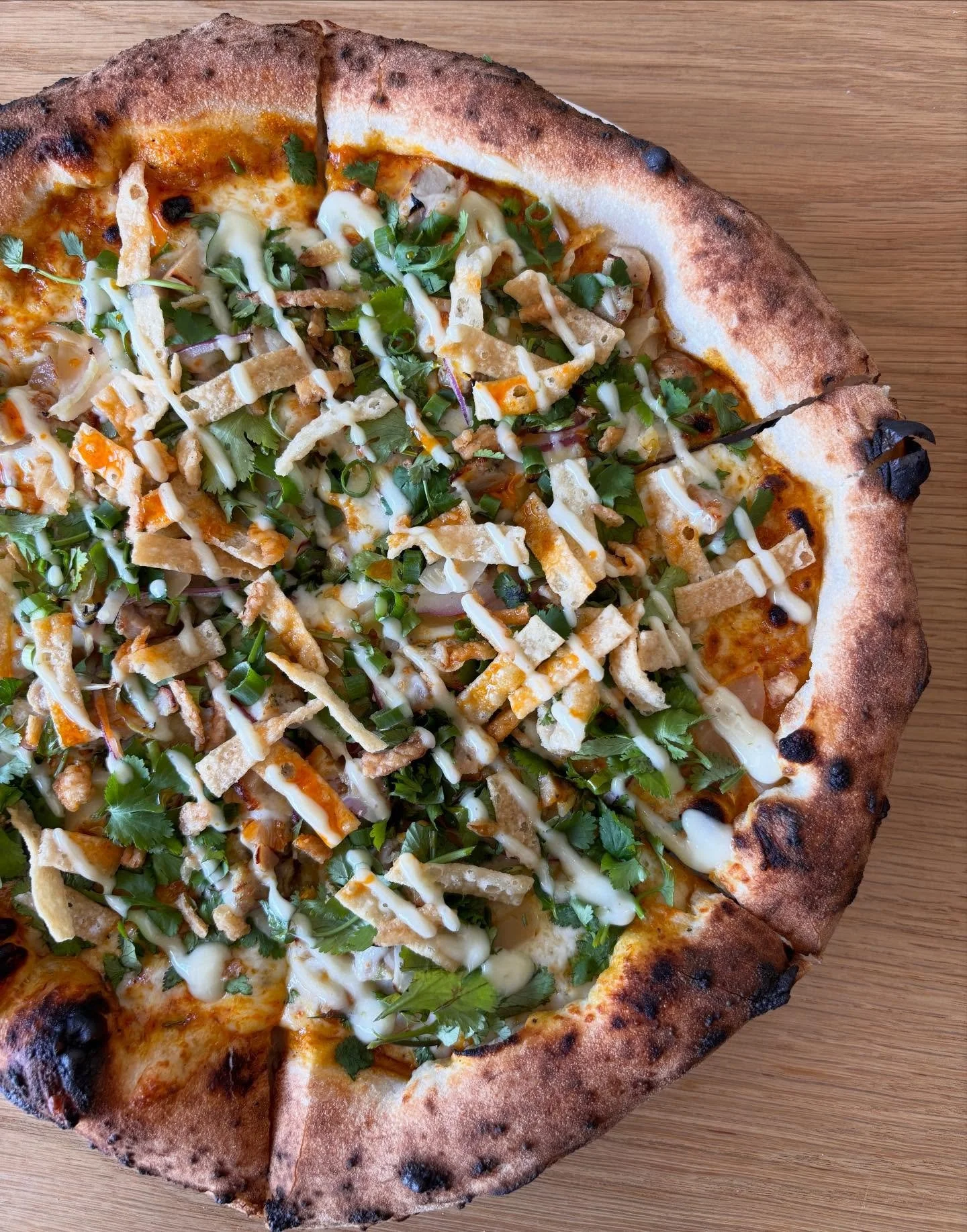 We&rsquo;re ringing in the new year with our most popular Thai curry pizza &mdash; Khao Soi Pizza 🙌🏽

// Thai Khao Soi curry, mozz, pickled mustard greens, red onions, cilantro, green onions, wonton strips, fried onions, chili oil, lime mayo, and y