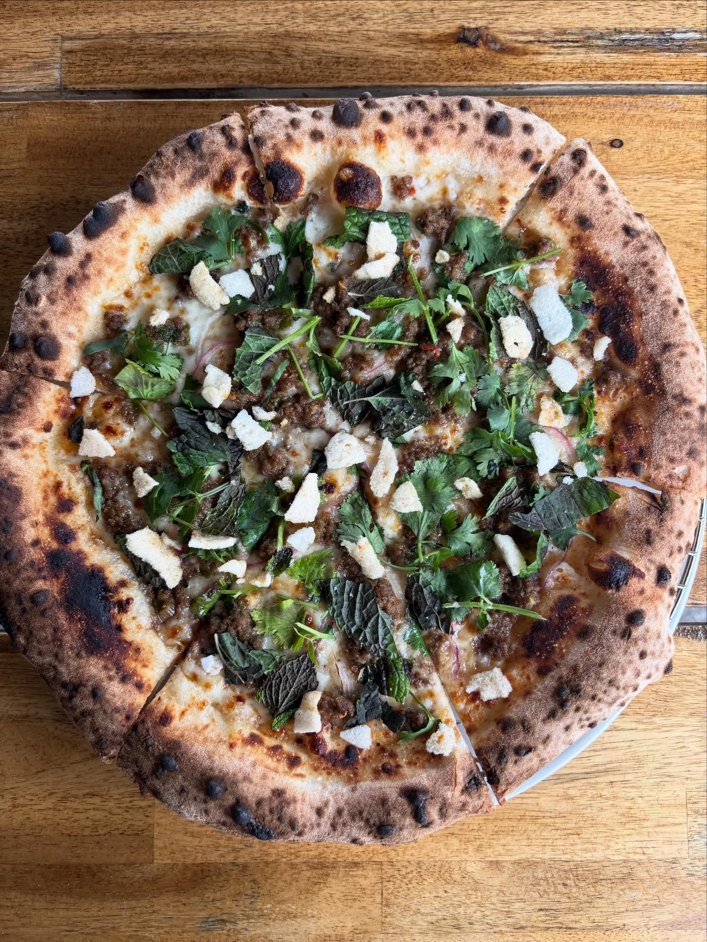 We&rsquo;re also bringing back our Thai Beef Pizza! 🌶️

// Thai beef larb, tamarind sauce, mozz, red onion, cilantro, mint, shrimp chips, fresh lime 🍋&zwj;🟩

Sweet. Tangy. Herby. 
A true flavor explosion in every bite.

Now available at the shop a
