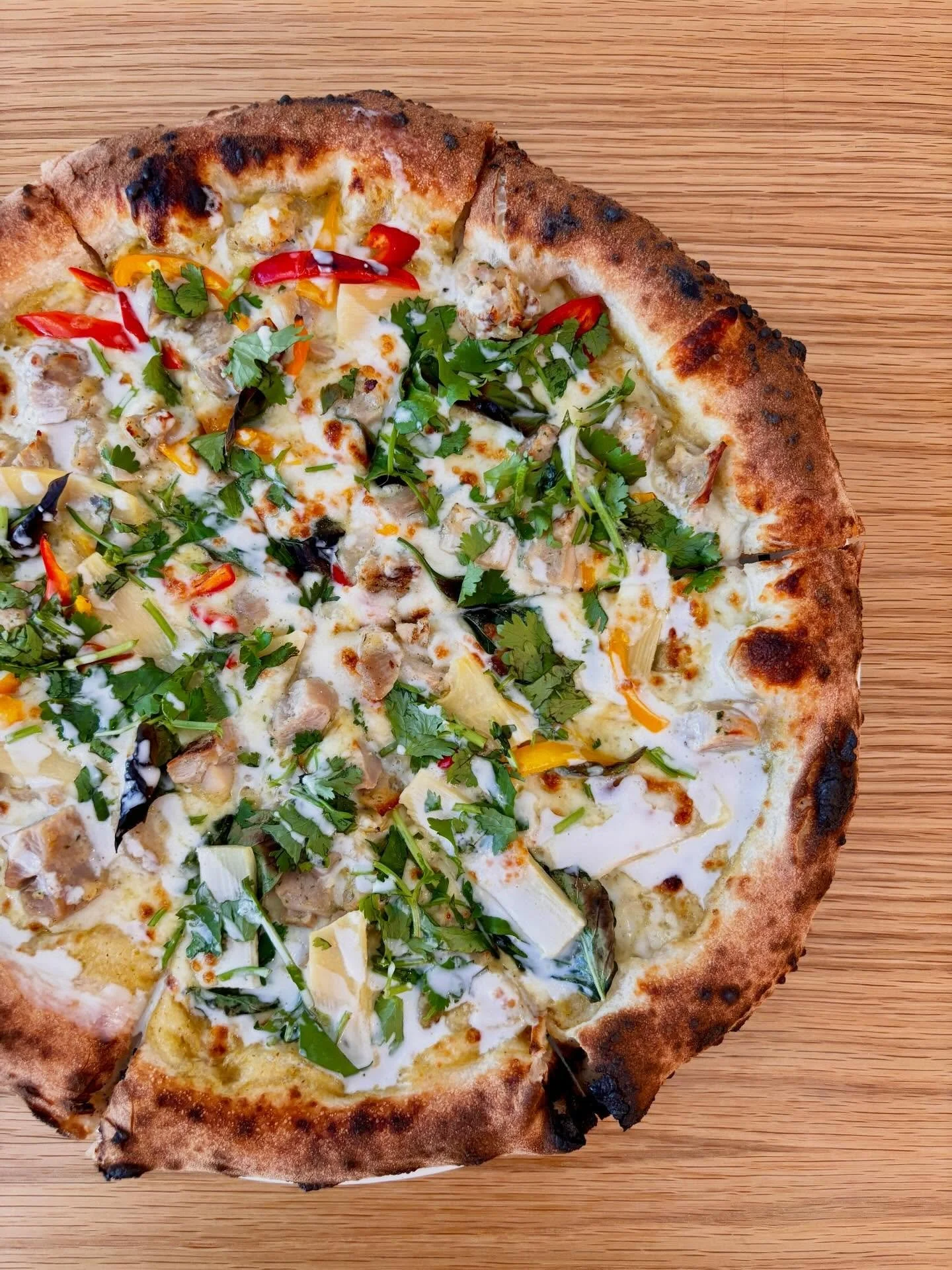 We&rsquo;re bringing back our Thai Green Curry Pizza!

// Green curry, mozz, bamboo shoots, bell peppers, Thai basil, cilantro, coconut milk drizzle, and your choice of chicken or tofu

A great vegetarian/ vegan option!

Now available at the shop and