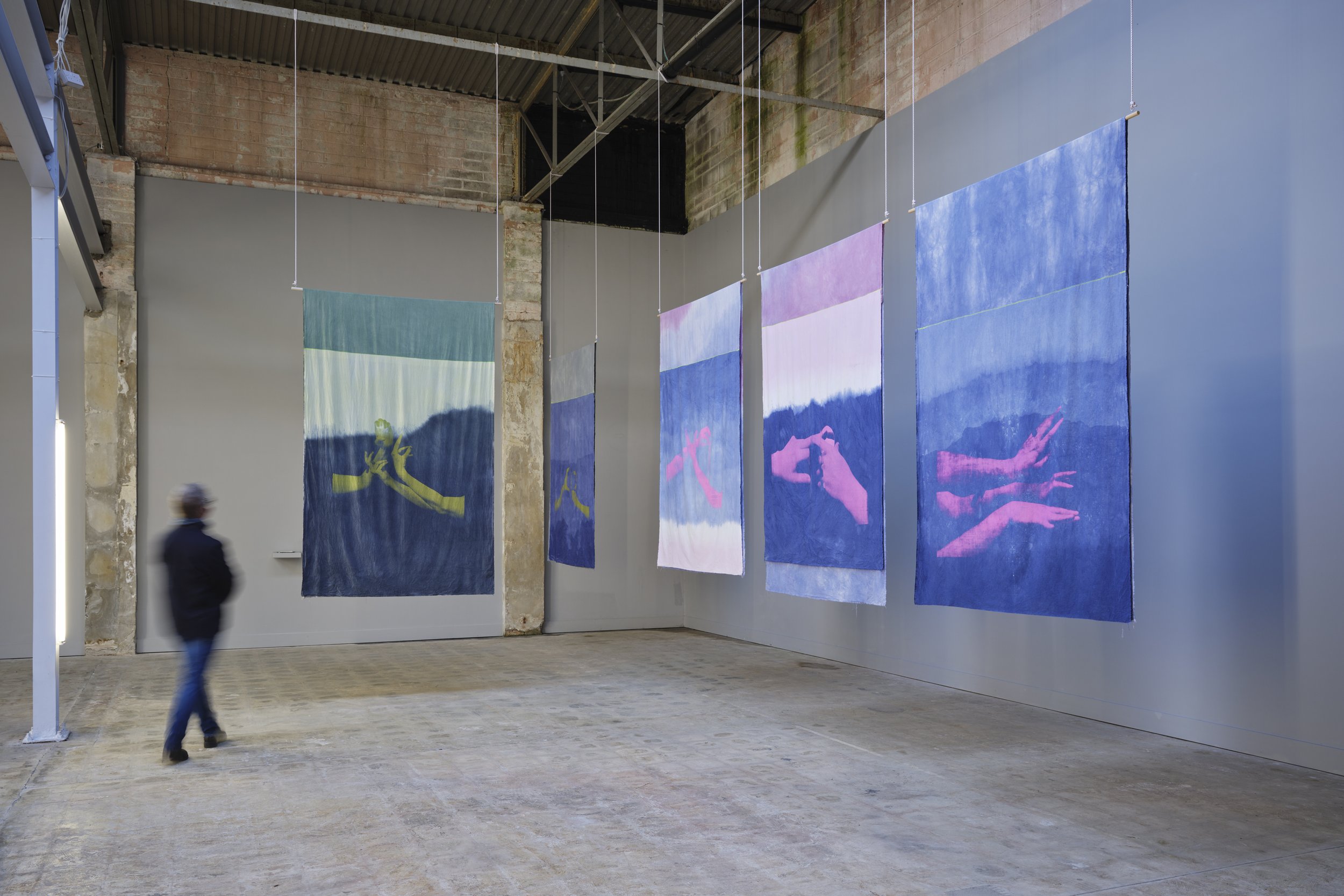  The Many Headed Hydra,&nbsp;Oracle Flags, 2017, hand-dyed cotton, screen printed images, wood and rope, with accompanying publications, installation view at An Post Gallery, November 2021; photograph by Ros Kavanagh, courtesty of the artists and TUL