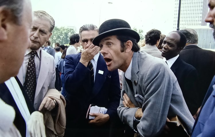 A group of men speaking animatedly