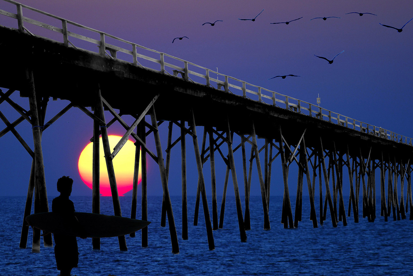 Surfer_Sunrise_Fishing_Pier_Pelicans_Composite_Silhouette_Endless_Summer_Kure_Beach_North_Carolina.jpg